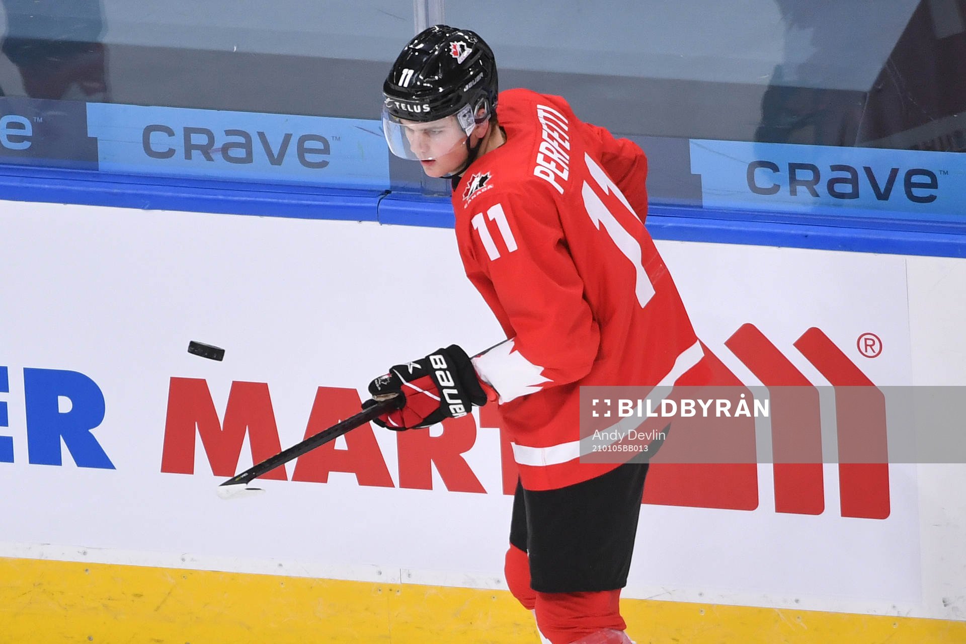 Cole Perfetti of Canada bounces the puck off this stick