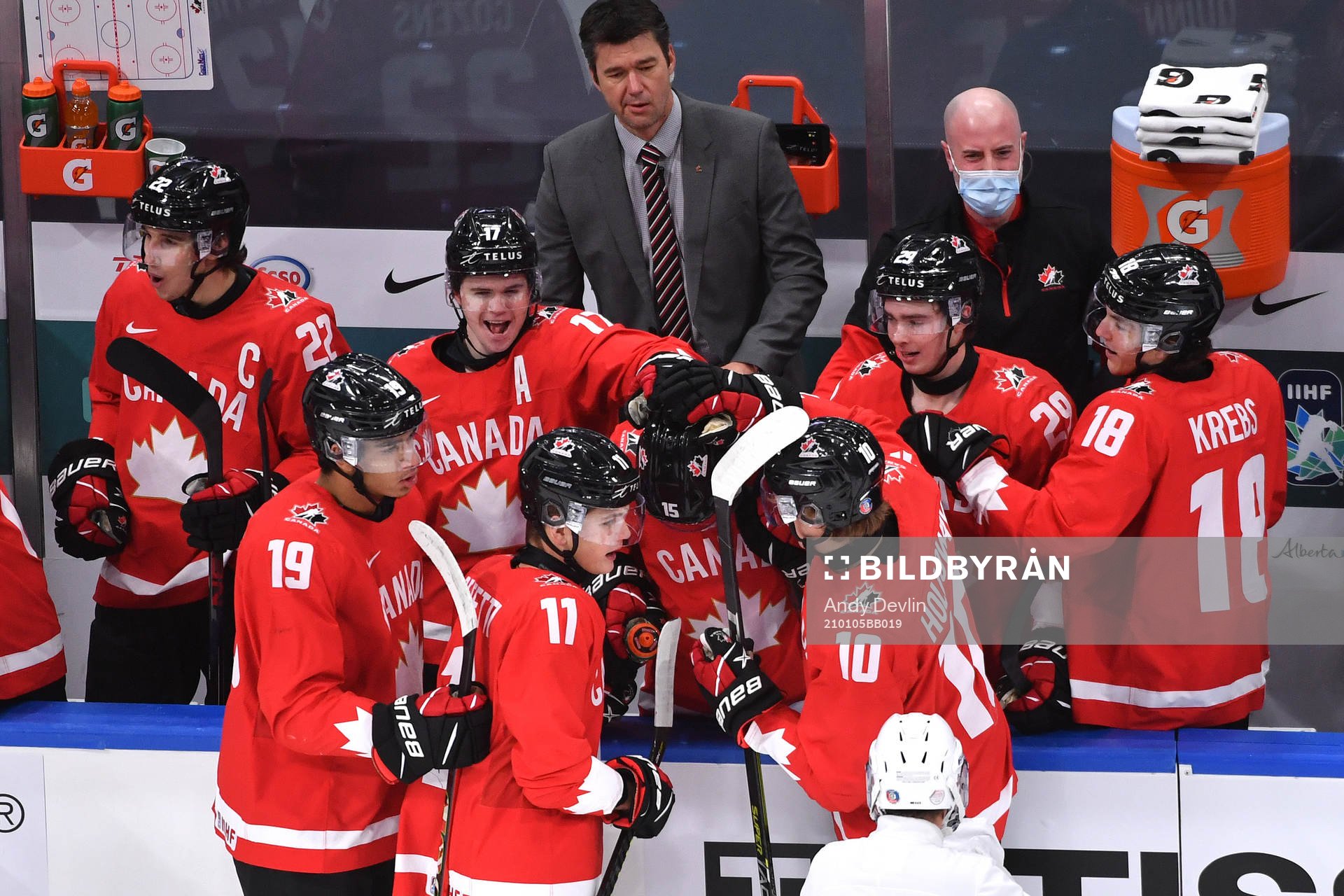 Alex Newhook of Canada is congratulated by teammates