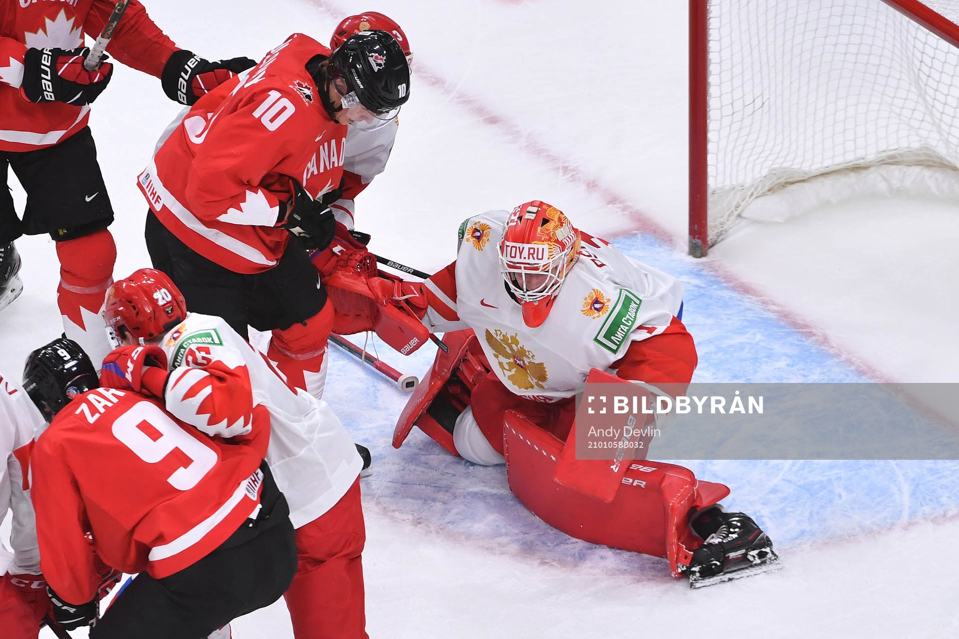 Yaroslav Askarov of Russia makes a save as Dylan Holloway