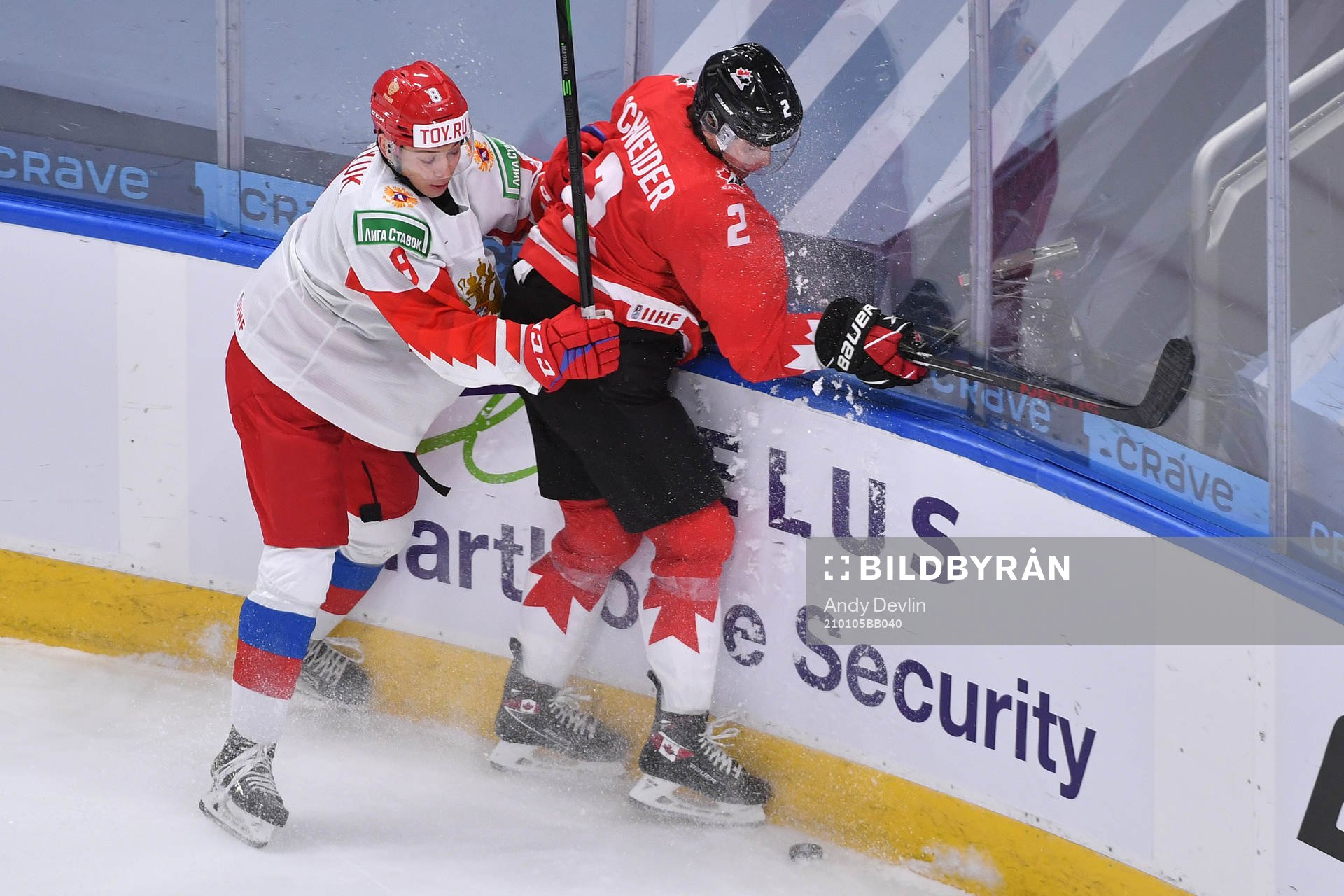 Arseni Gritsyuk of Russia collides with Braden Schneider of