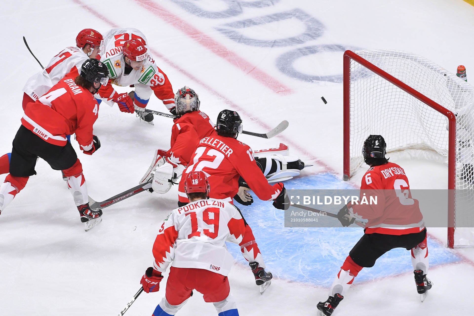 Marat Khusnutdinov of Russia shoots the puck wide of the