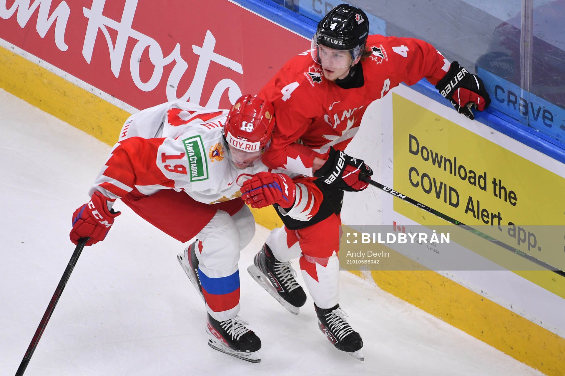Vasili Podkolzin of Russia collides with Bowen Byram of