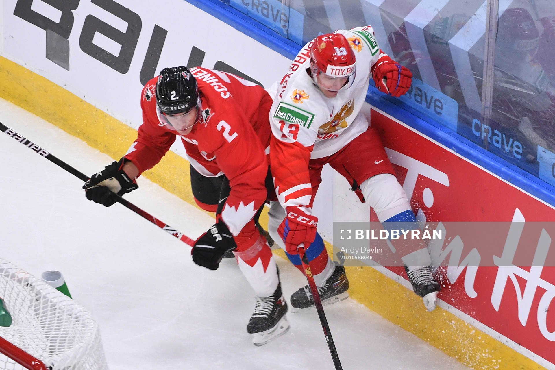 Braden Schneider of Canada collides with Vasili Ponomaryov