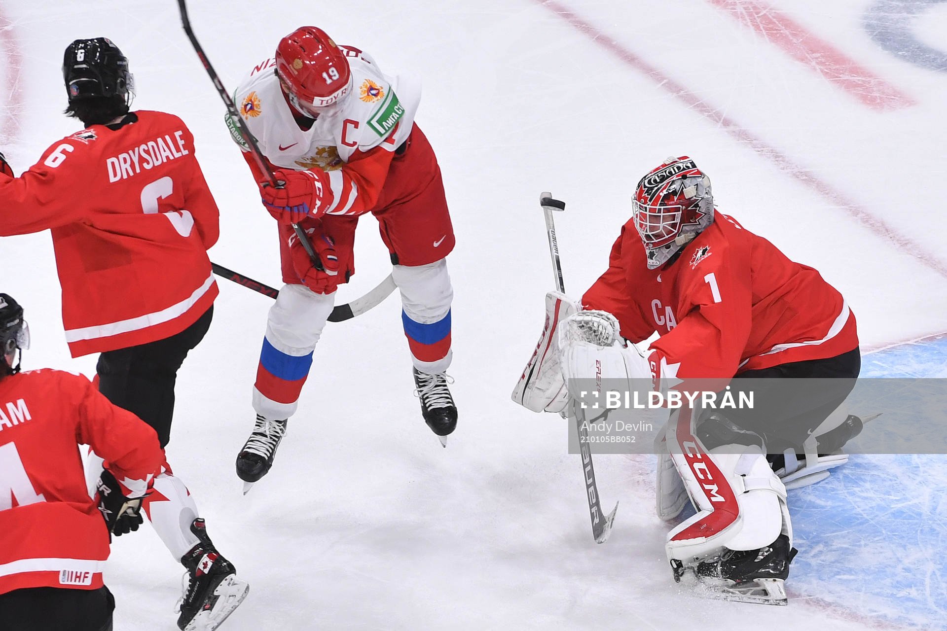 Devon Levi of Canada makes a save