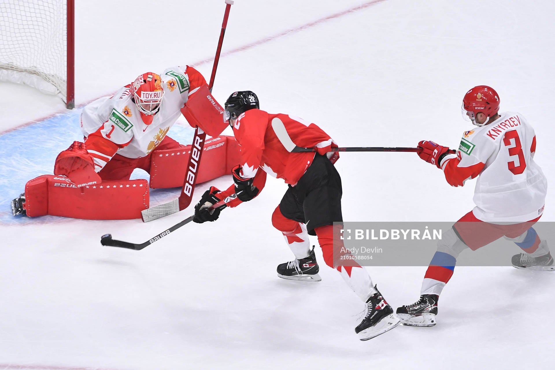 Artemi Knyazev of Russia hooks Dylan Cozens of Canada