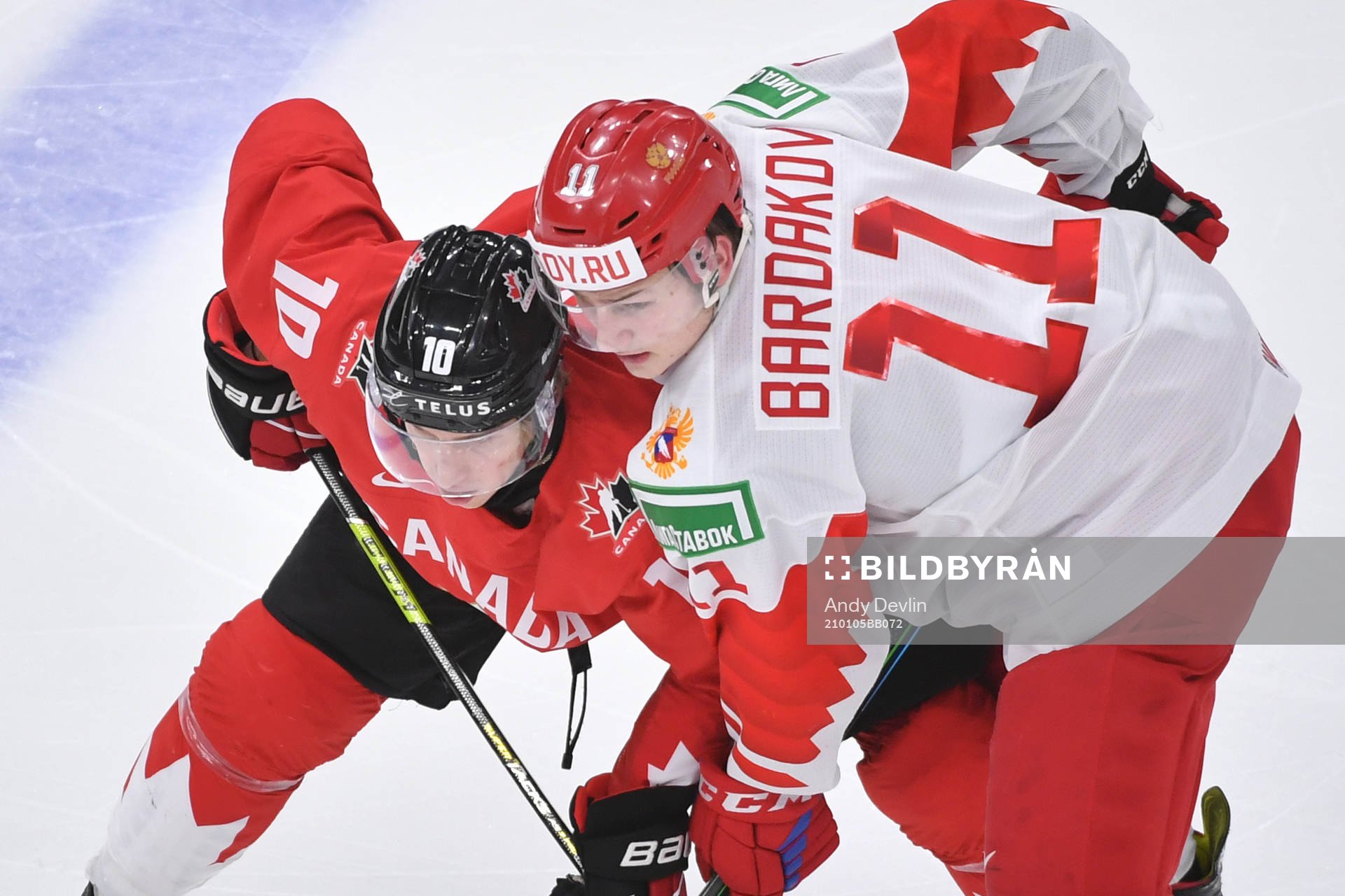 Dylan Holloway of Canada battles Zakhar Bardakov of Russia