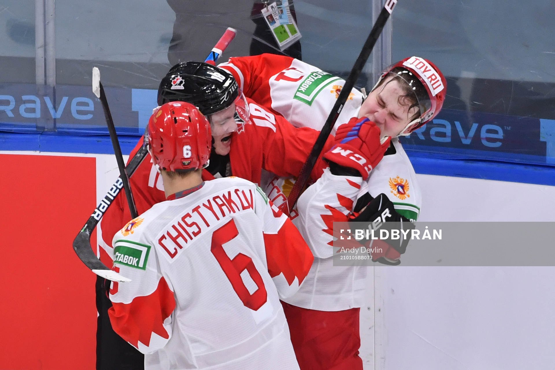 Peyton Krebs of Canada scrums with Zakhar Bardakov of Russia