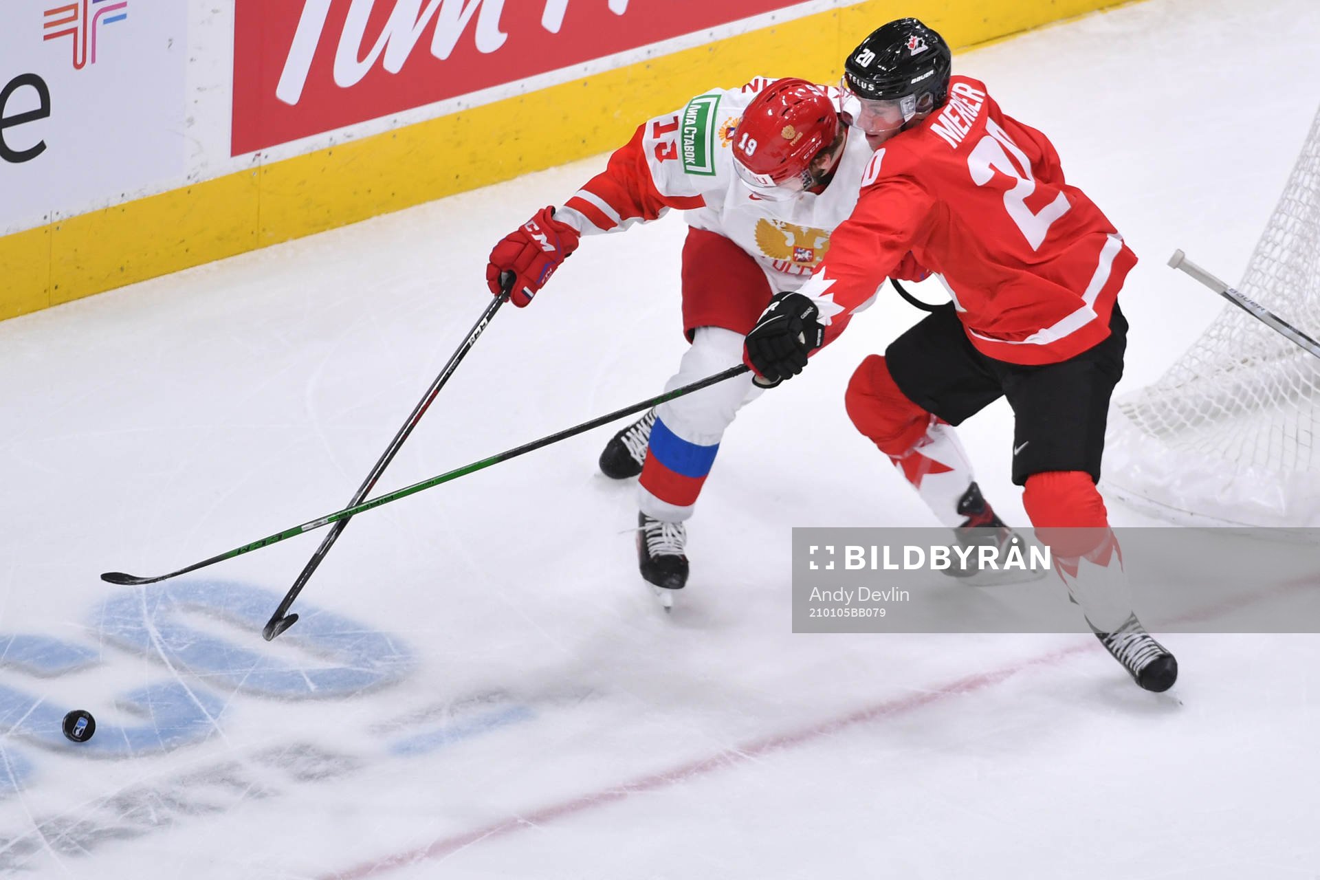 Vasili Podkolzin of Russia fends off Dawson Mercer of Canada