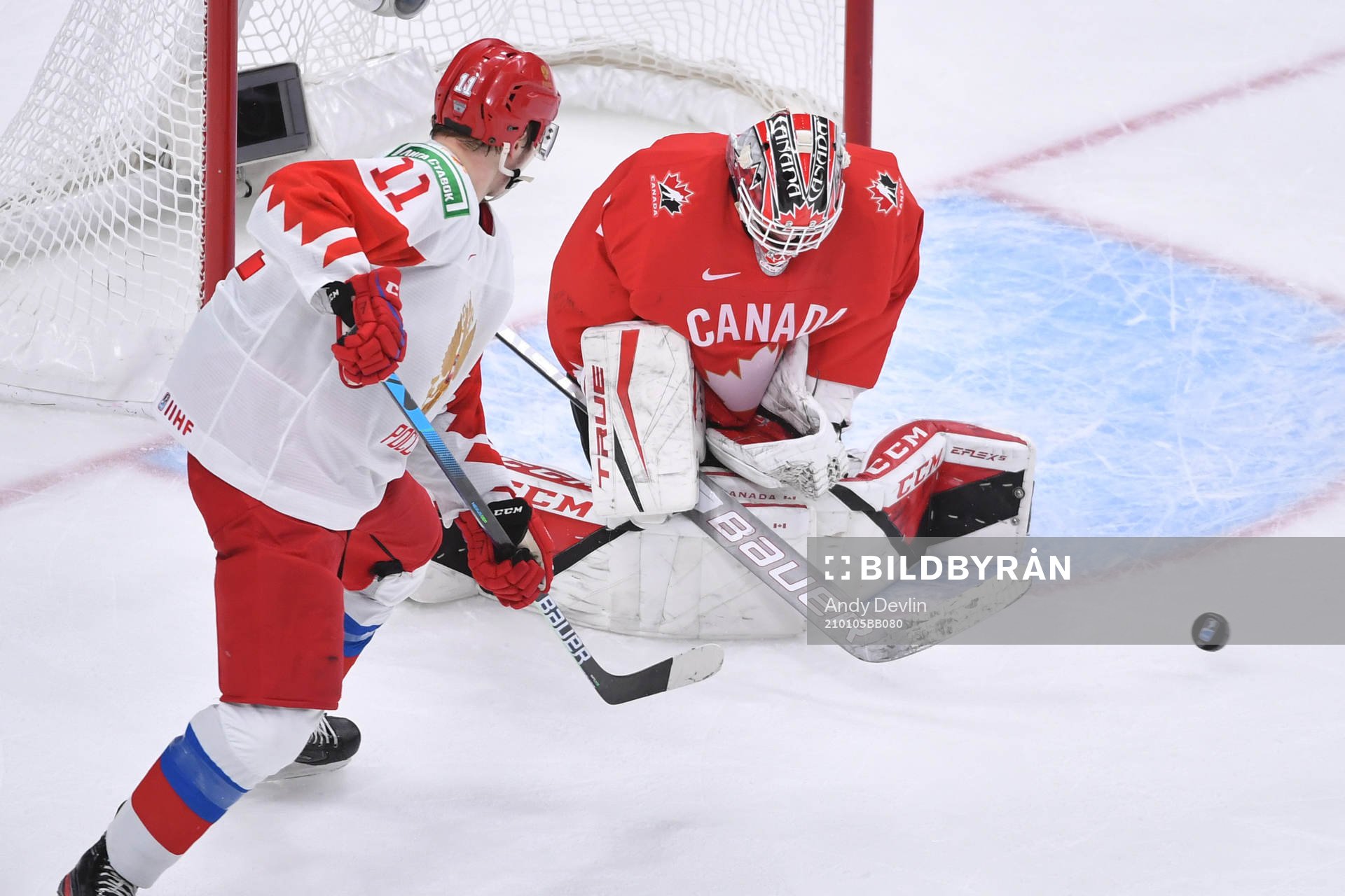 Devon Levi of Canada makes a save