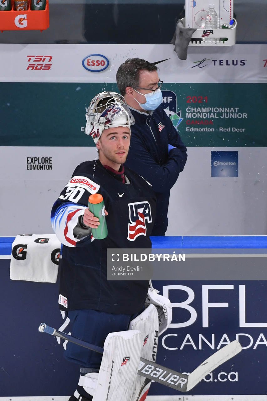 Spencer Knight of USA sprays water in the air