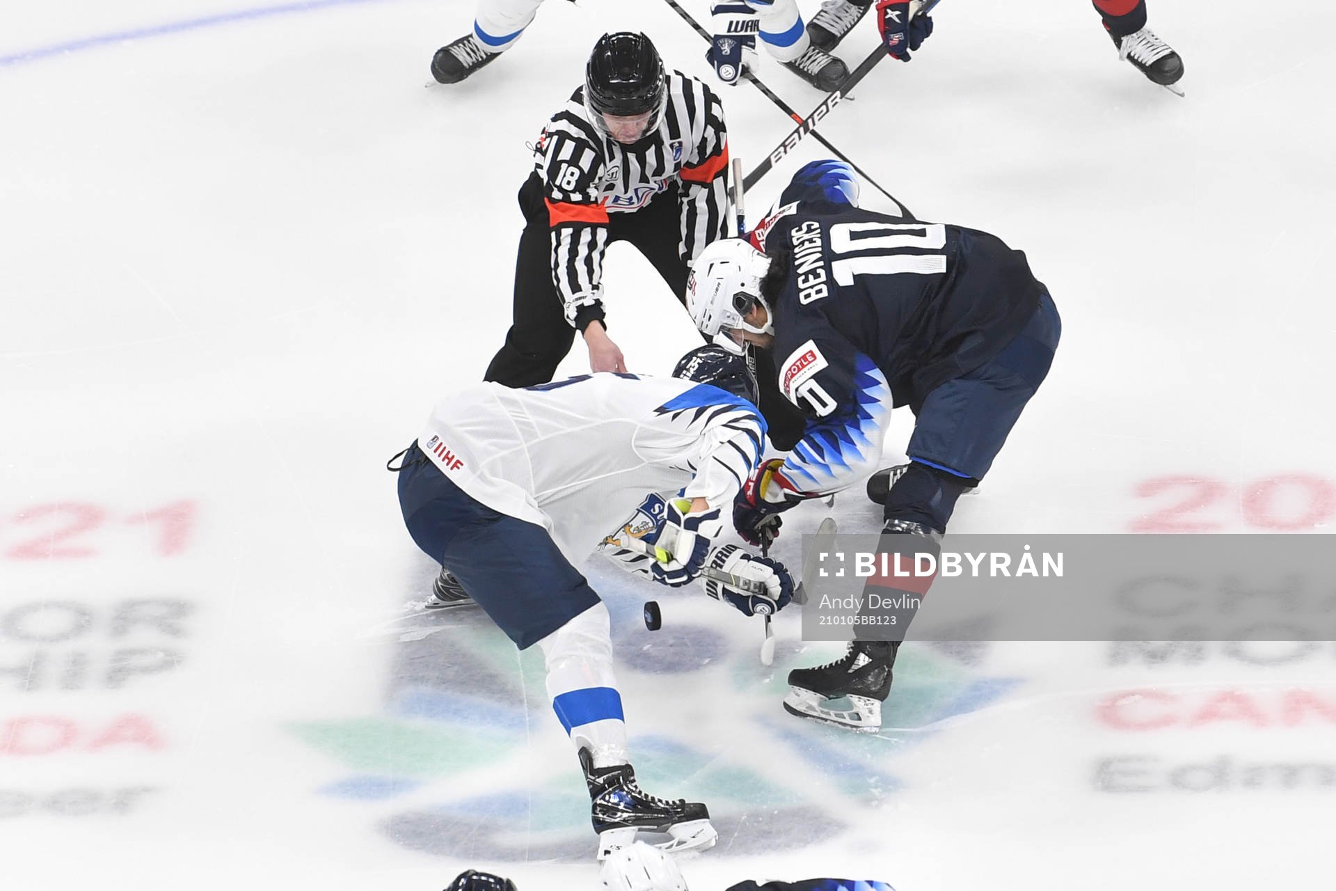 Matthew Beniers of USA and Anton Lundell of Finland face off