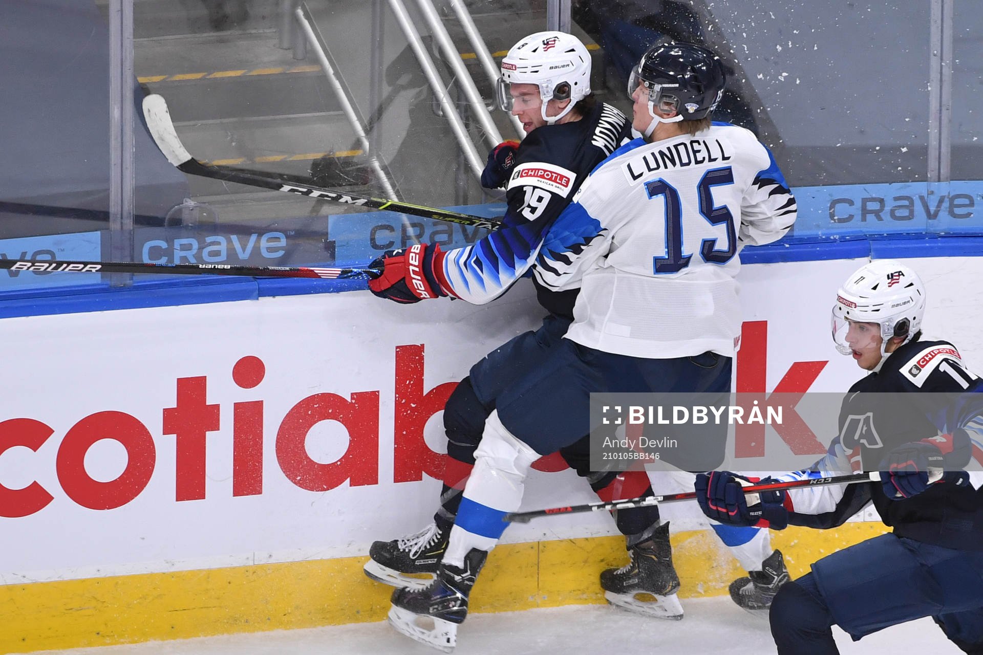 Anton Lundell of Finland collides with Patrick Moynihan of