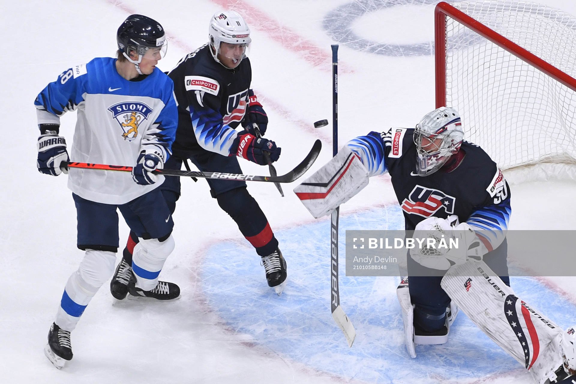 Spencer Knight of USA makes a blocker with Henri Nikkanen