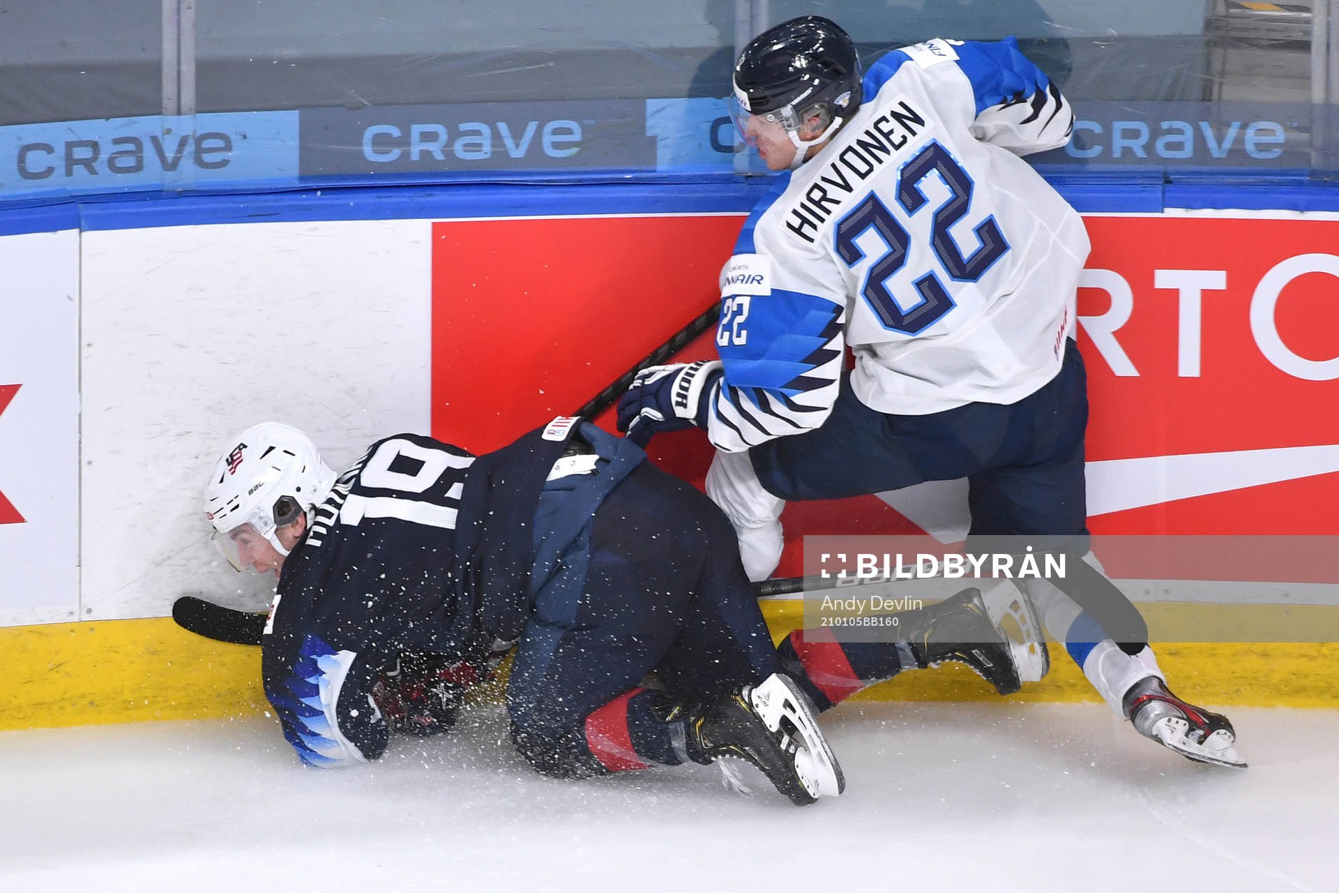Roni Hirvonen of Finland collides against the boards with