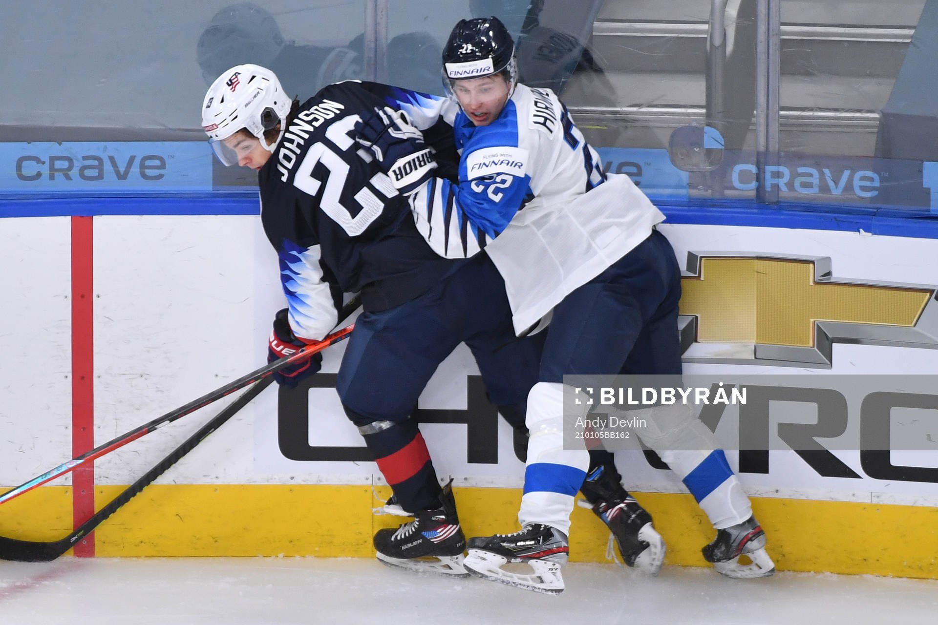 Roni Hirvonen of Finland collides with Ryan Johnson of USA