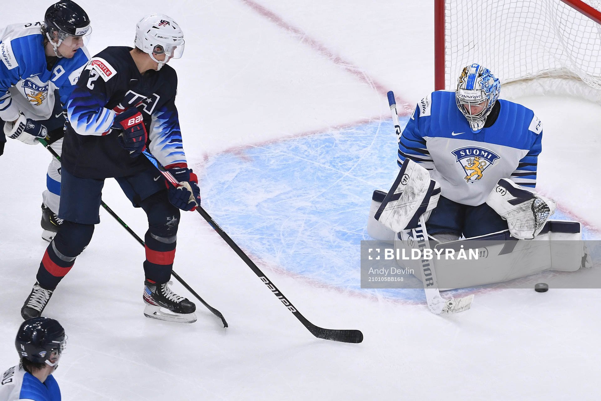 Kari Piiroinen of Finland makes a save with Matthew Boldy
