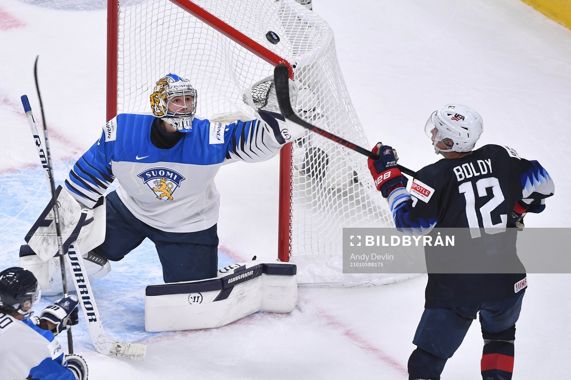 Kari Piiroinen of Finland and Matthew Boldy of USA reach