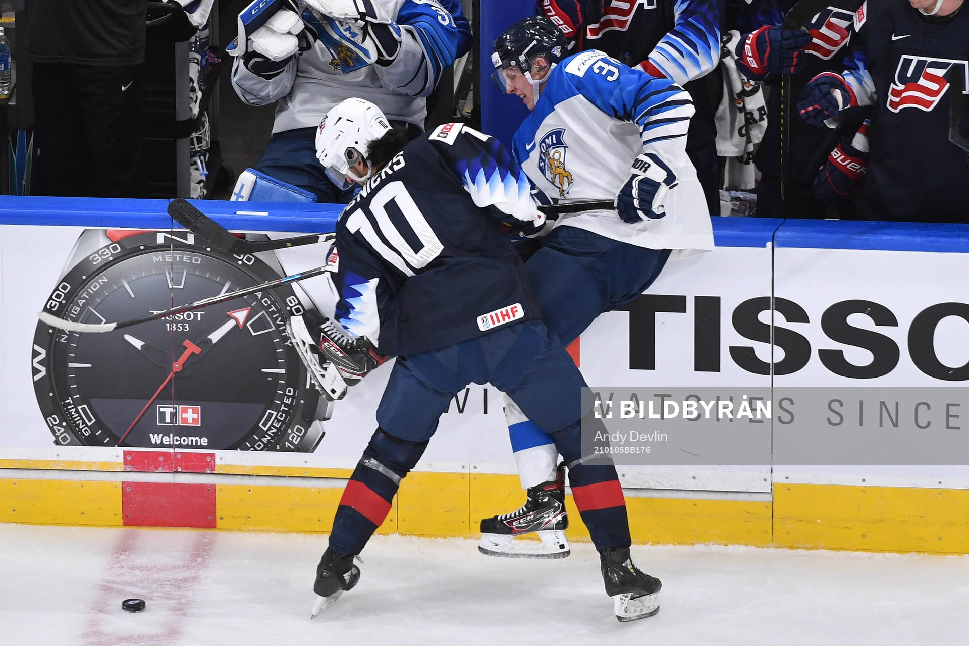 Matthew Beniers of USA and Aku Raty of Finland collide