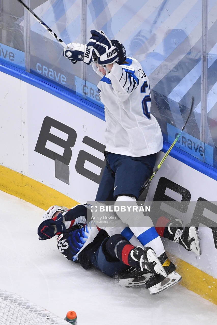 Samuel Helenius of Finland collides with Ryan Johnson of USA