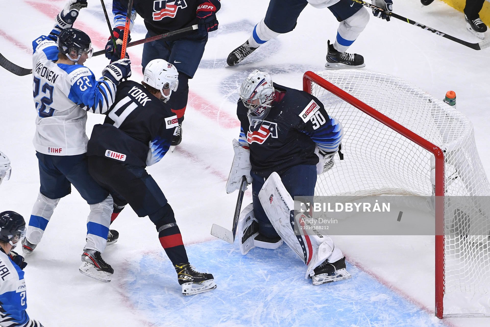 Roni Hirvonen of Finland watches the puck enter the USA net