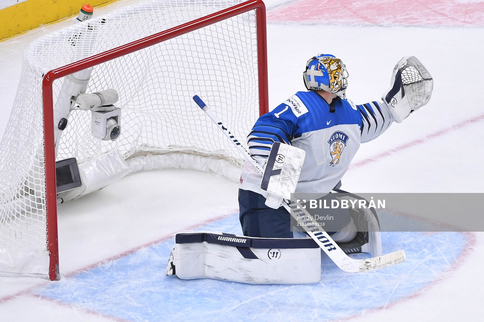 Kari Piiroinen of Finland can not stop the puck as it