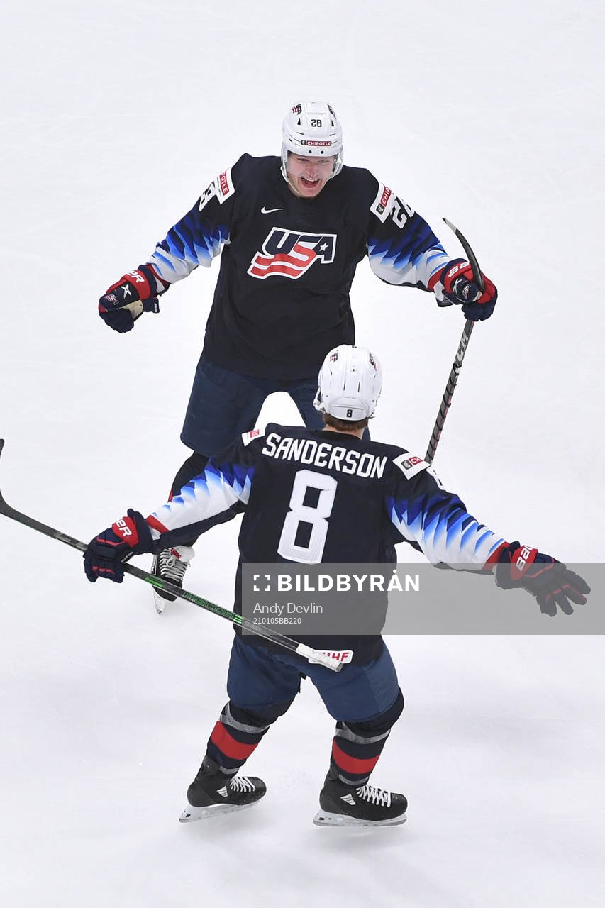Arthur Kaliyev of USA celebrates with teammate Jake