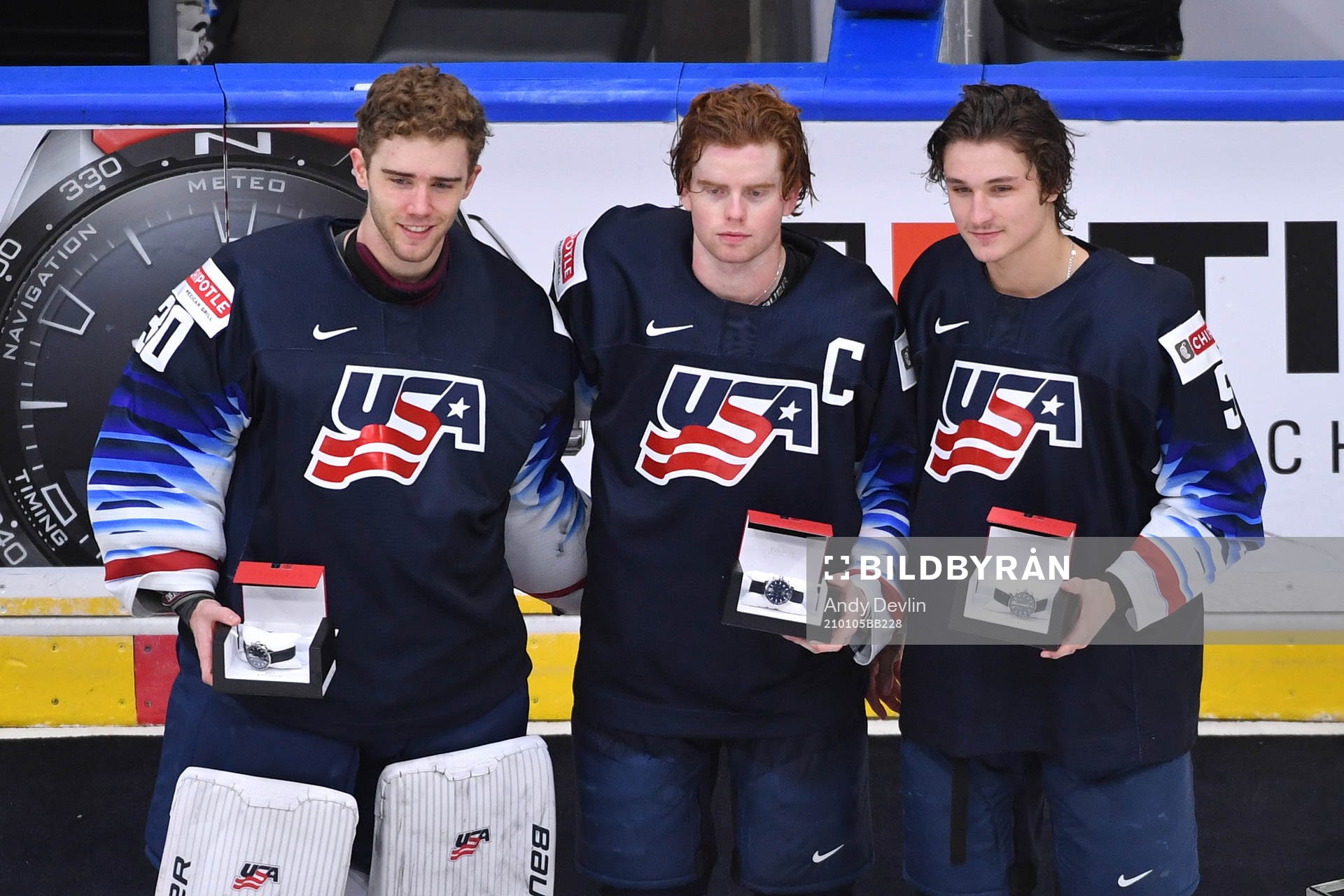 Spencer Knight, Cam York and Trevor Zegras of USA pose for