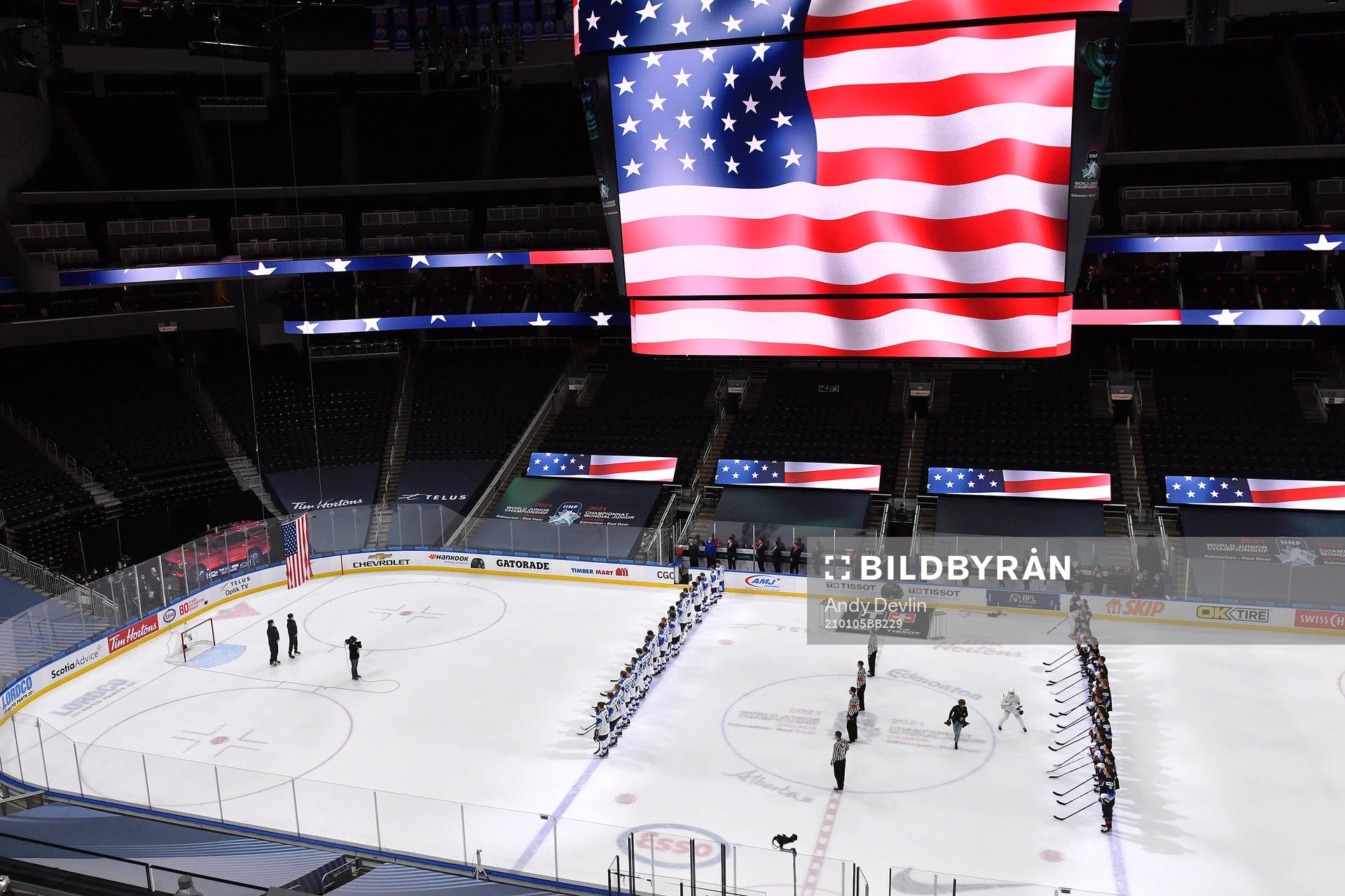 Team Finland and Team USA stand for the playing of the USA