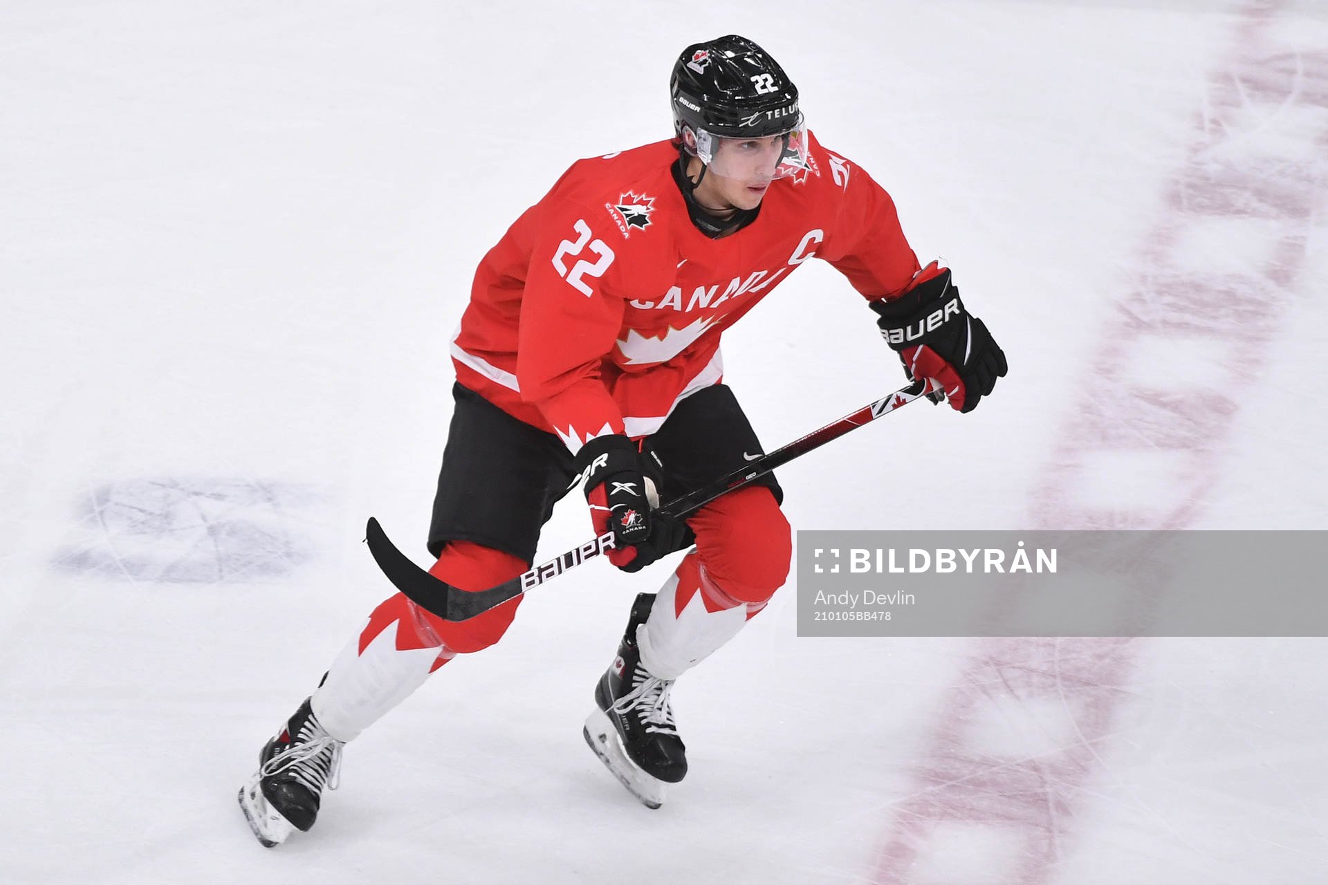 Dylan Cozens of Canada skates