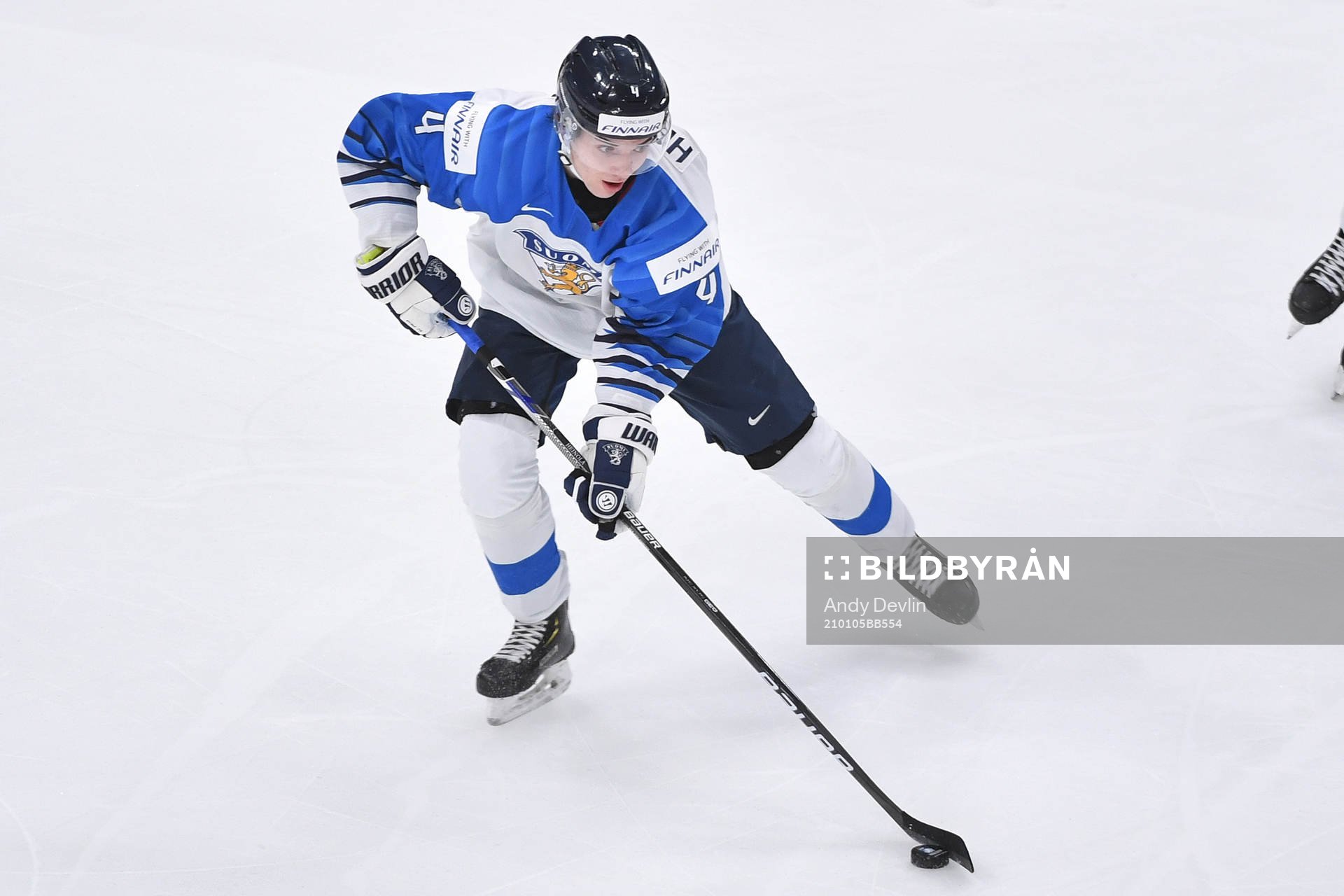 Ville Heinola of Finland skates with the puck