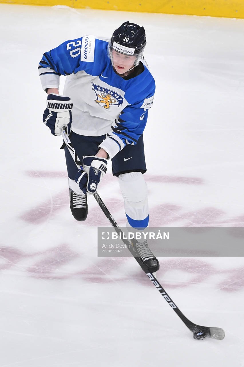 Samuel Helenius of Finland skates with the puck