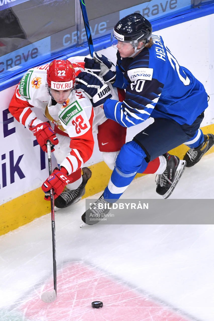 Samuel Helenius of Finland collides with Marat Khusnutdinov