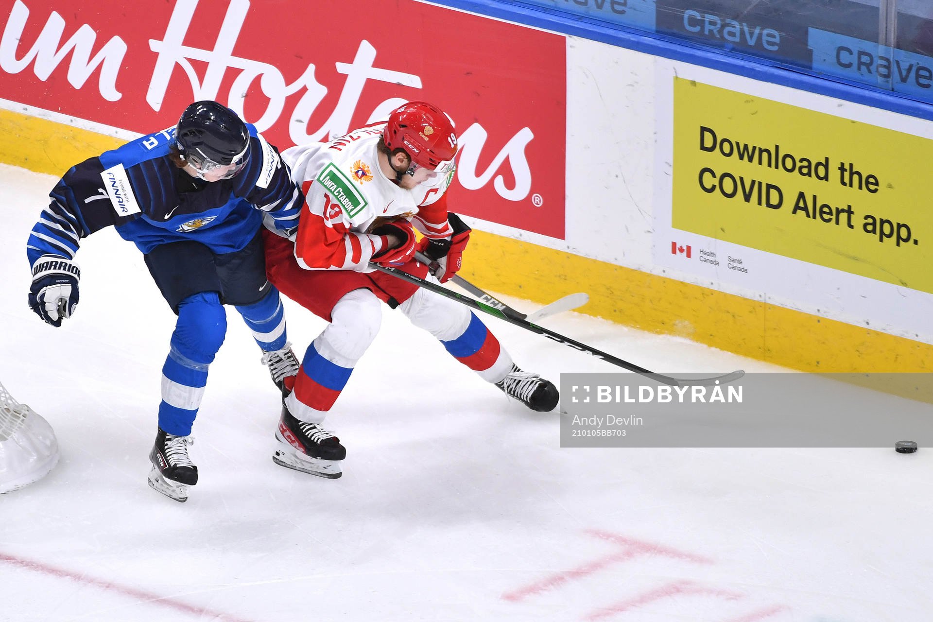 Vasili Podkolzin of Russia uses his body to fend off Topi