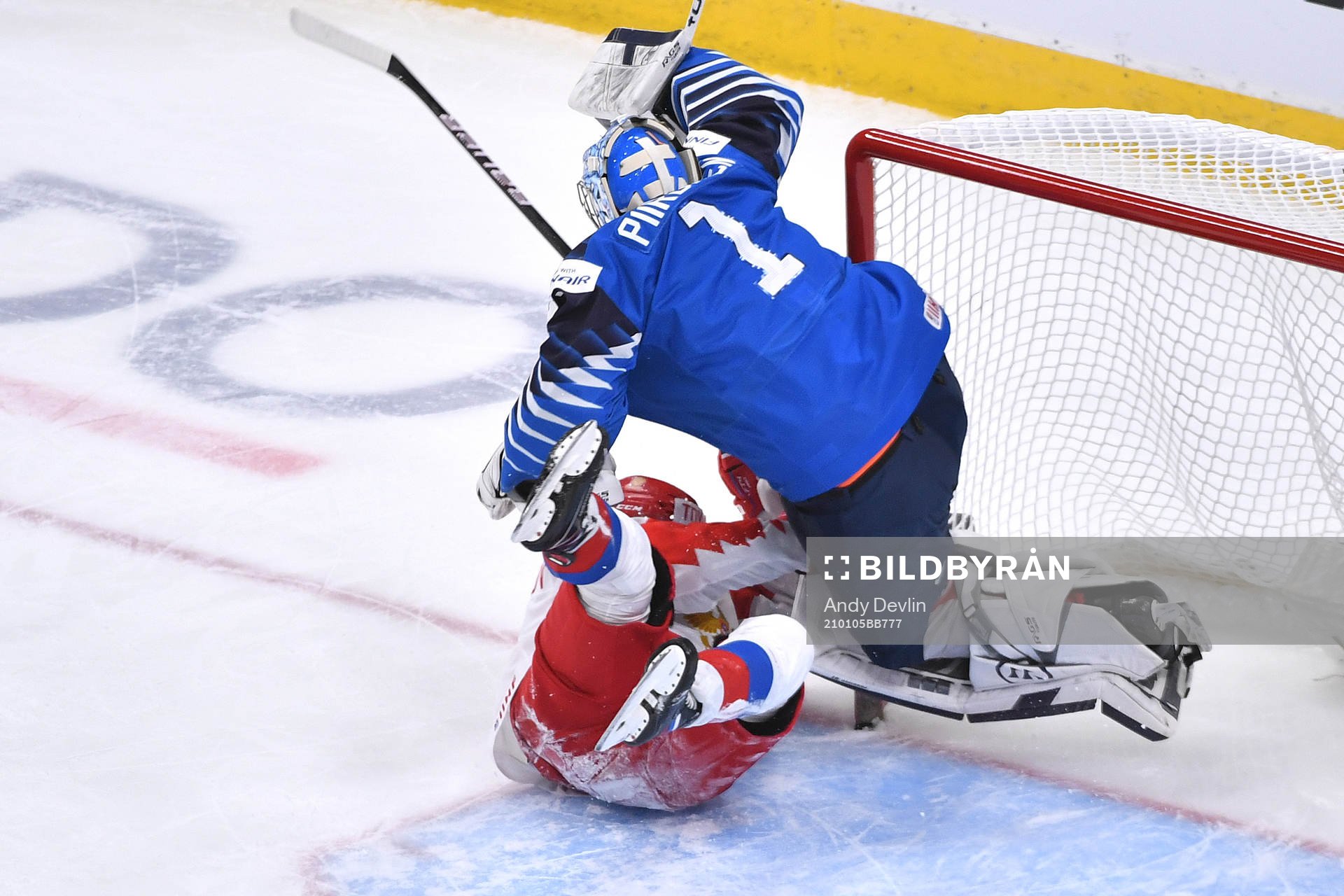 Vasili Ponomaryov of Russia collides with Kari Piiroinen of