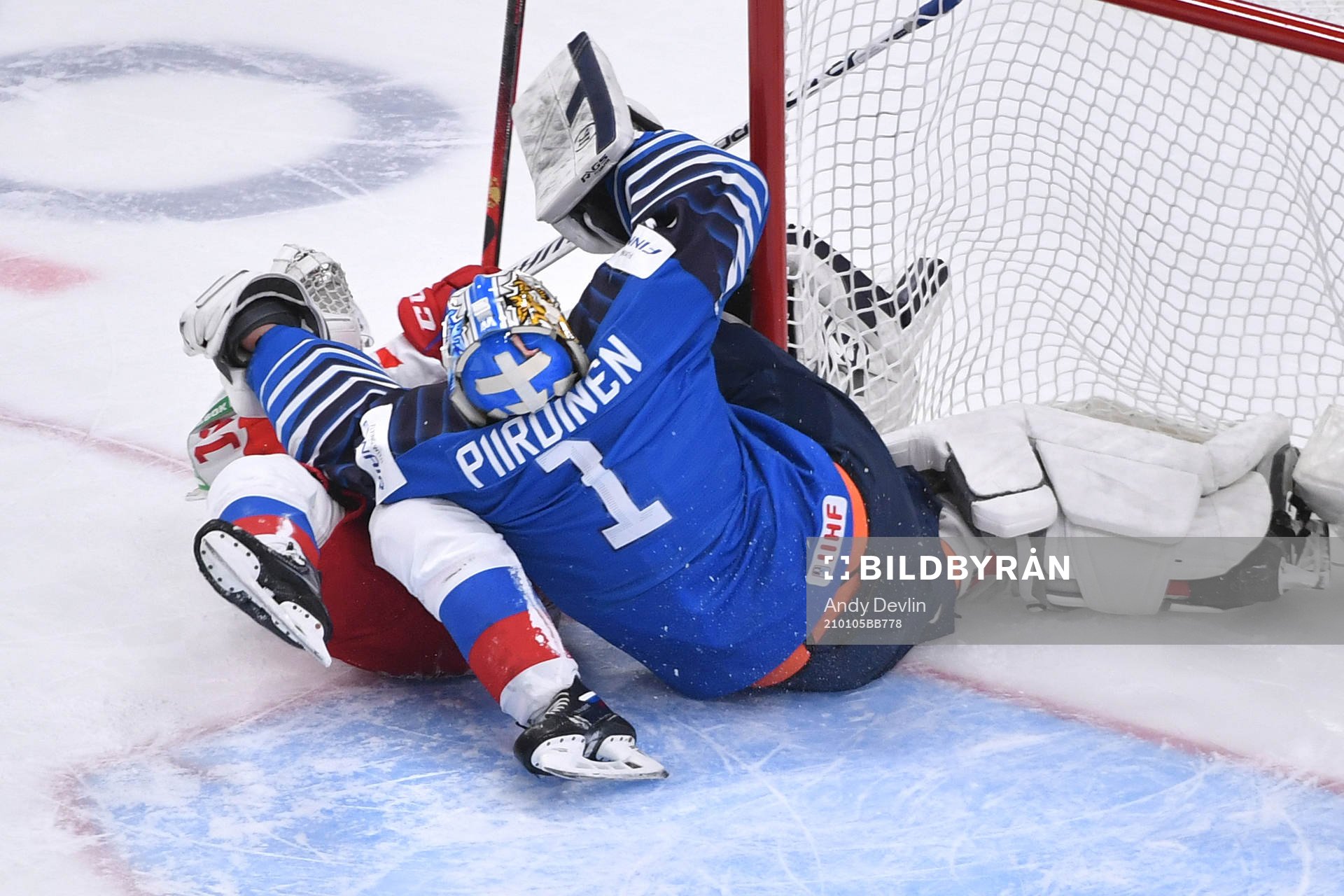 Vasili Ponomaryov of Russia collides with Kari Piiroinen of