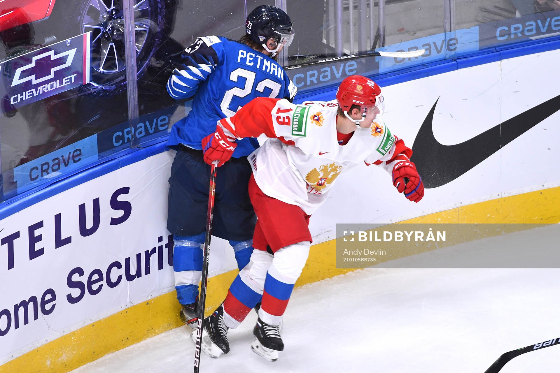 Vasili Podkolzin of Russia collides with Mikko Petman of