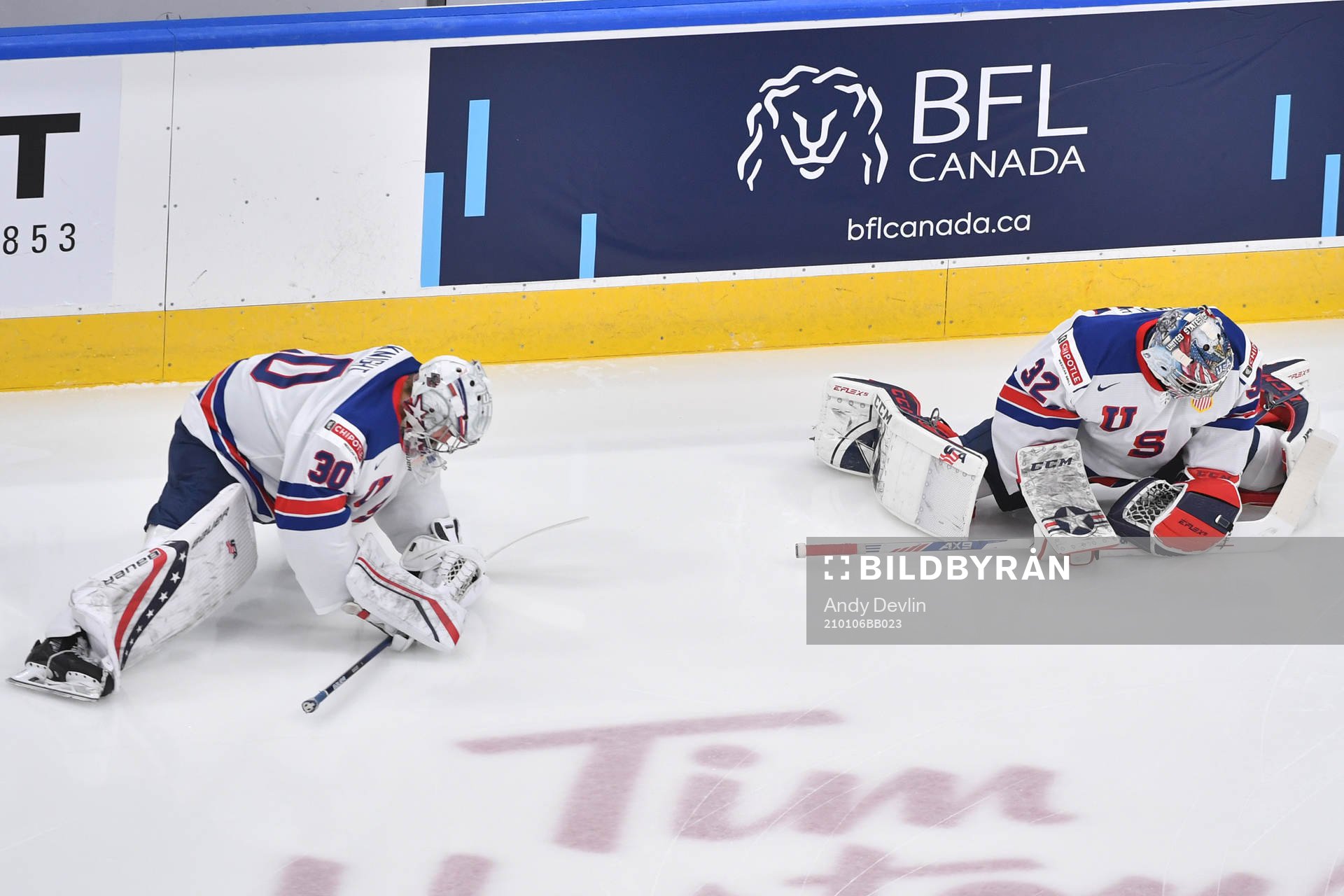 Dustin Wolf and Spencer Knight of USA stretch