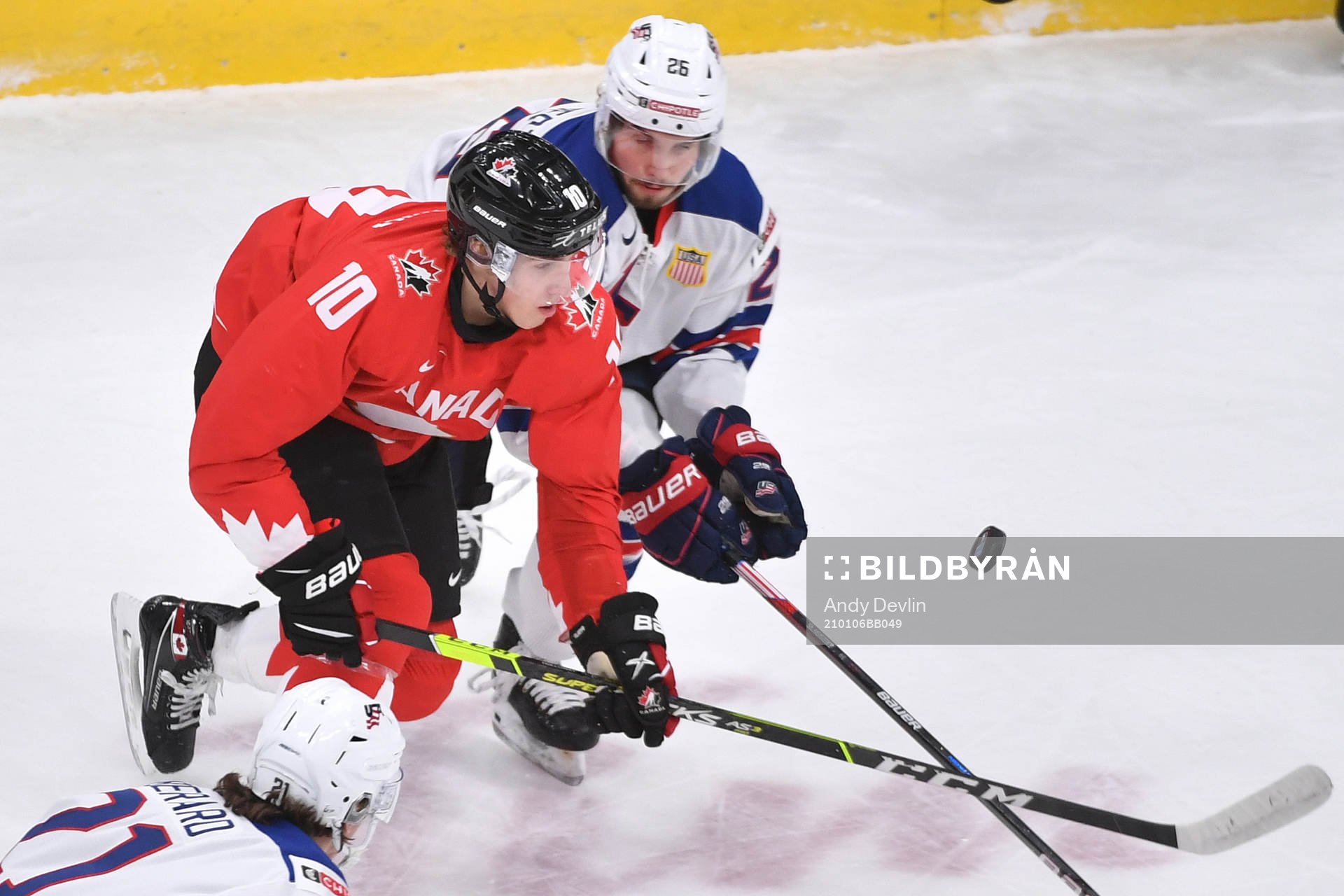 Dylan Holloway of Canada and Landon Slaggert of USA battle