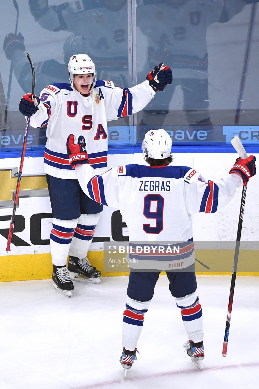 Alex Turcotte and Trevor Zegras of USA celebrate the 1-0
