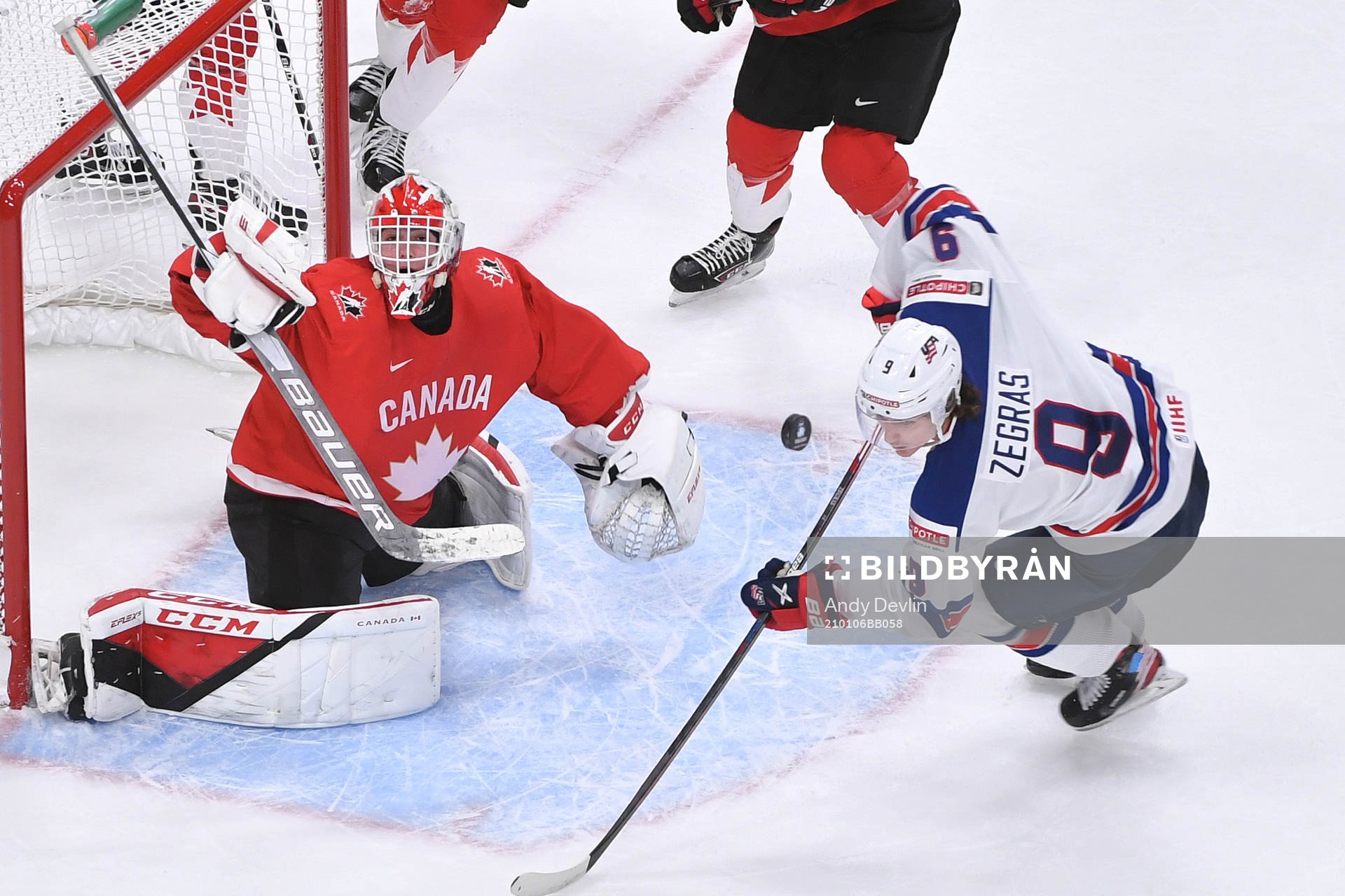 Devon Levi of Canada makes a save