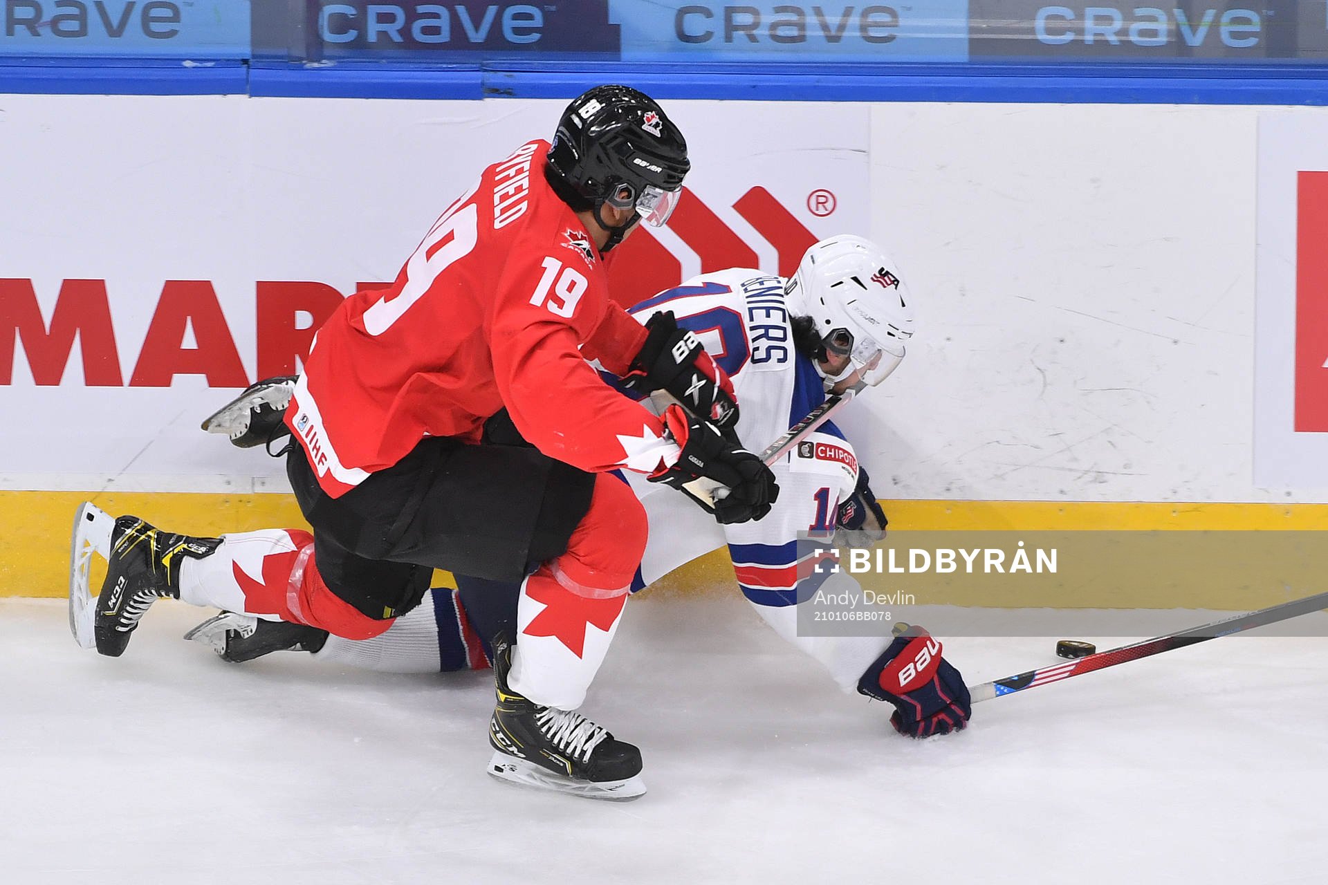 Quinton Byfield of Canada knocks Matthew Beniers of USA to