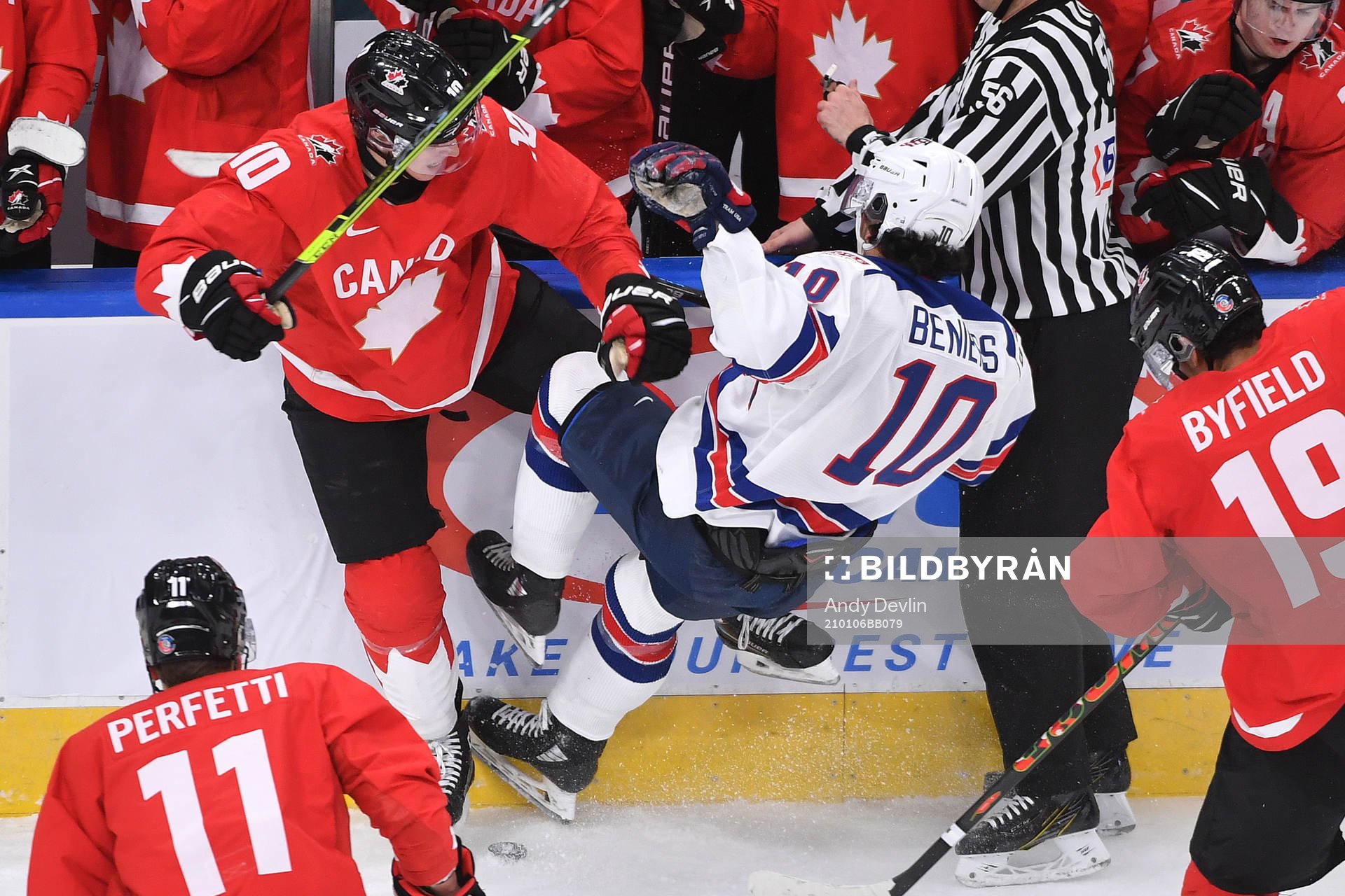 Dylan Holloway of Canada collides with Matthew Beniers of
