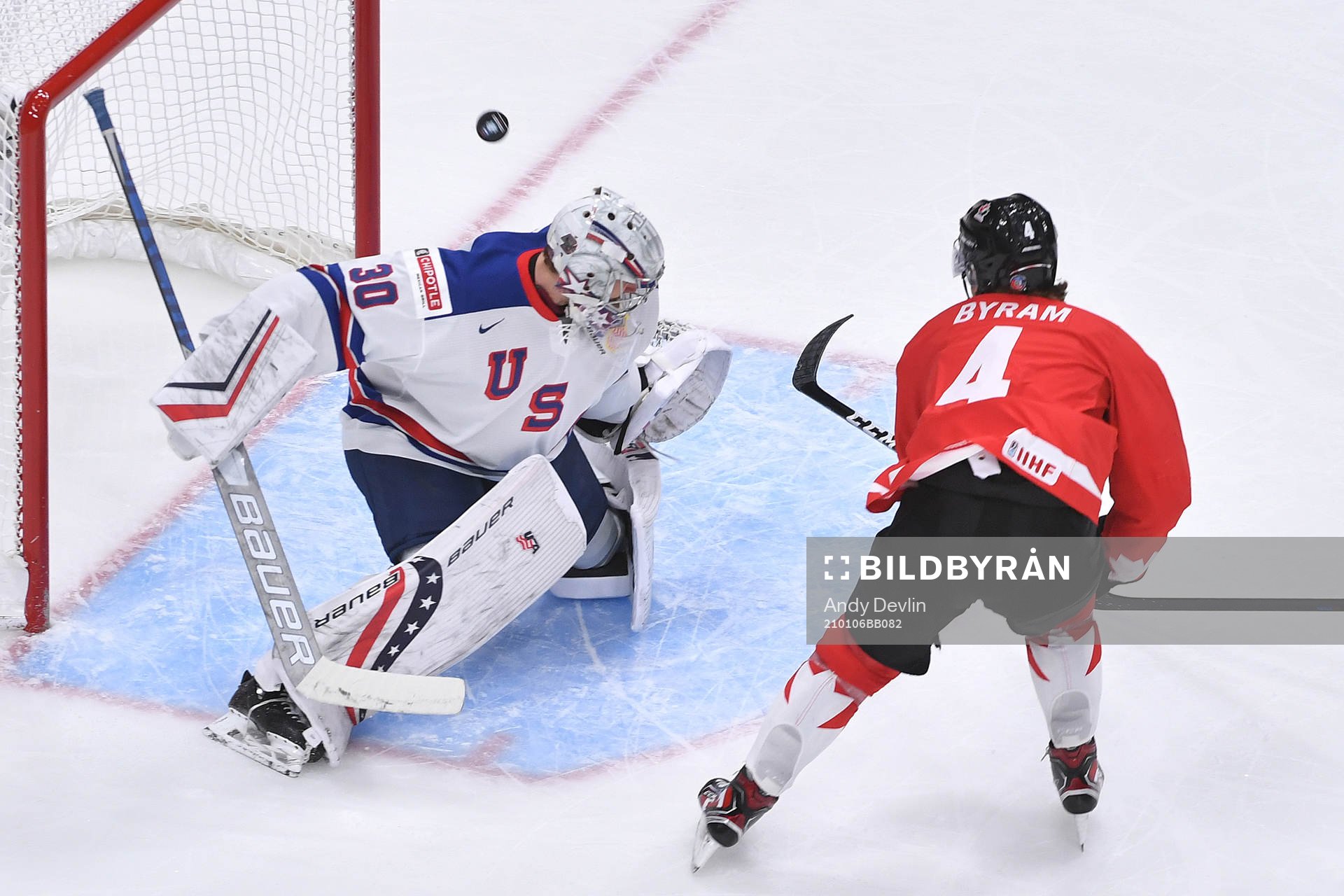 Spencer Knight of USA makes a save off Bowen Byram of Canada