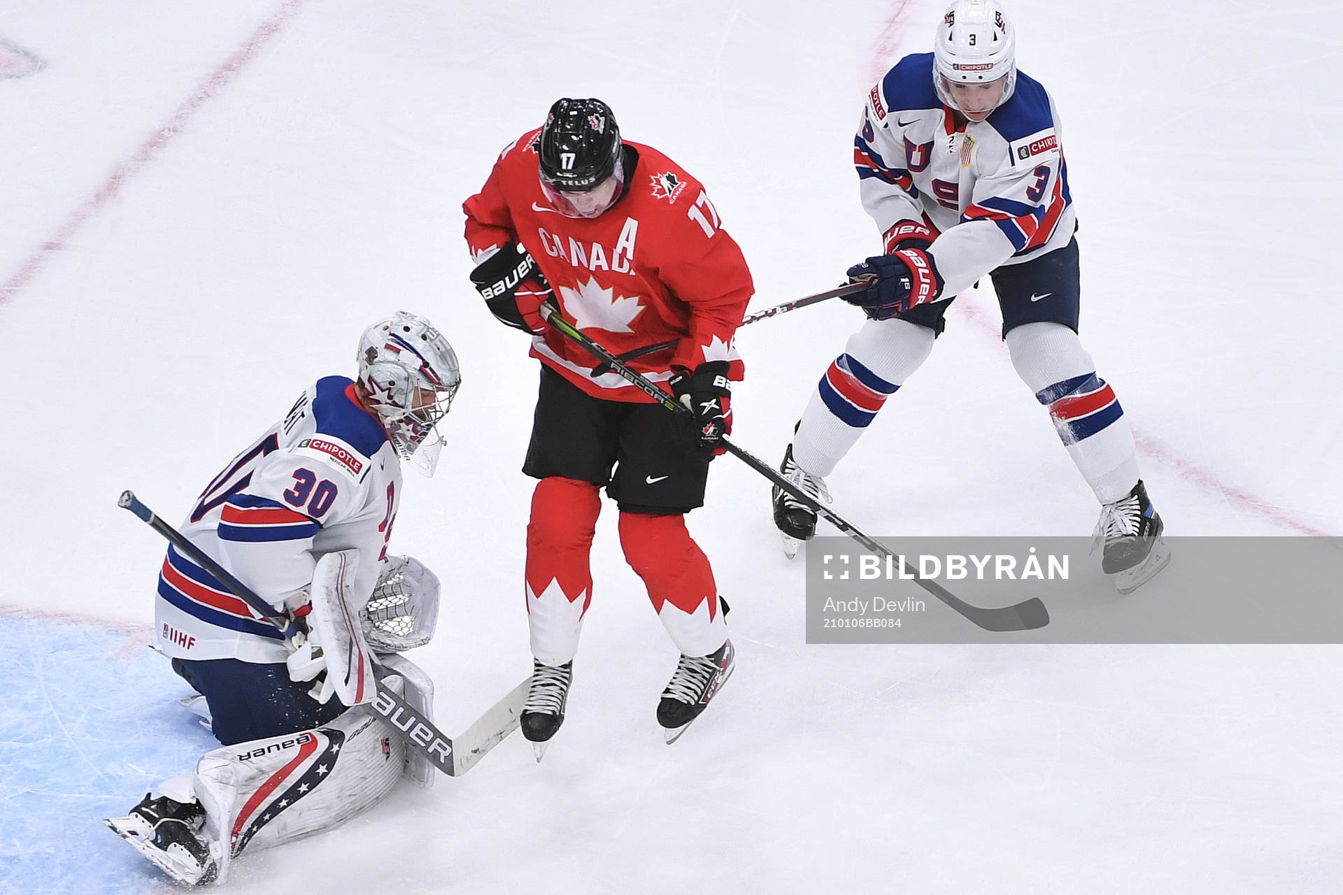 Connor McMichael of Canada attempts to tip the puck in