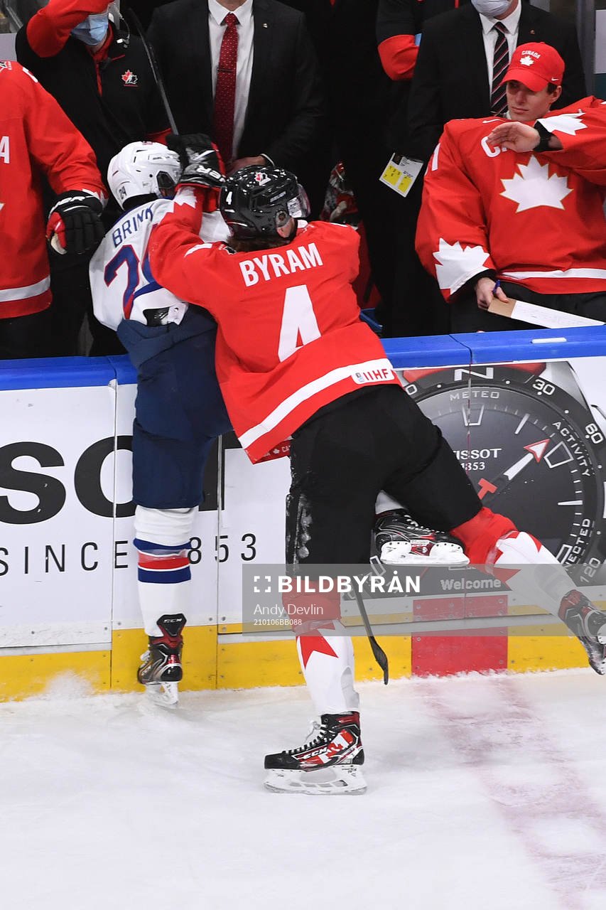 Bowen Byram of Canada knocks Bobby Brink of USA  into the