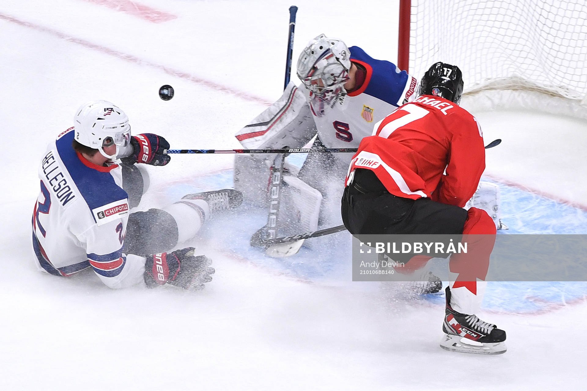 Connor McMichael of Canada crashes the net as the puck