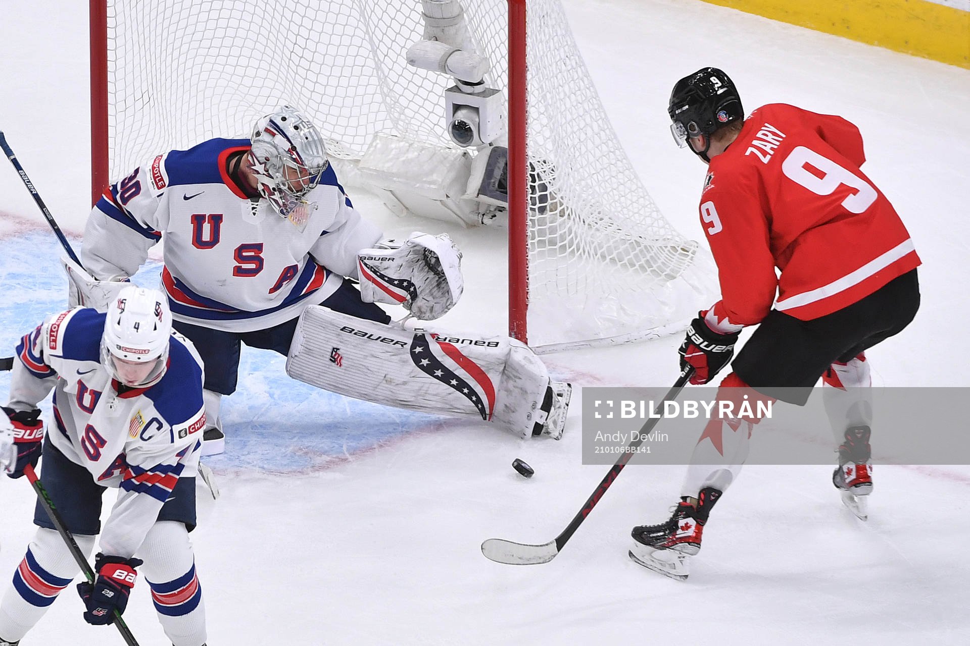 Spencer Knight of USA makes a third period save