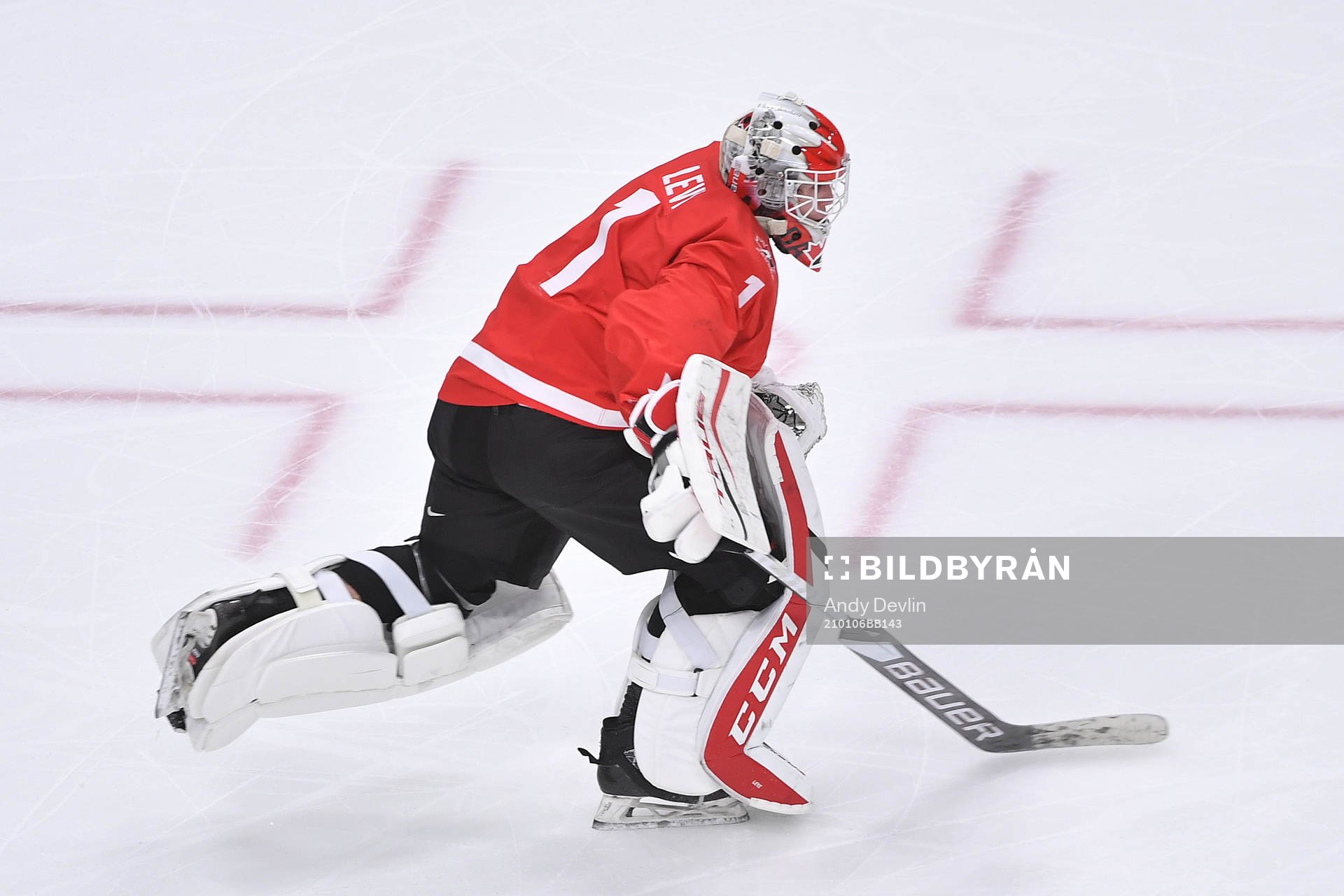 Devon Levi of Canada leaves his net for an extra attacker