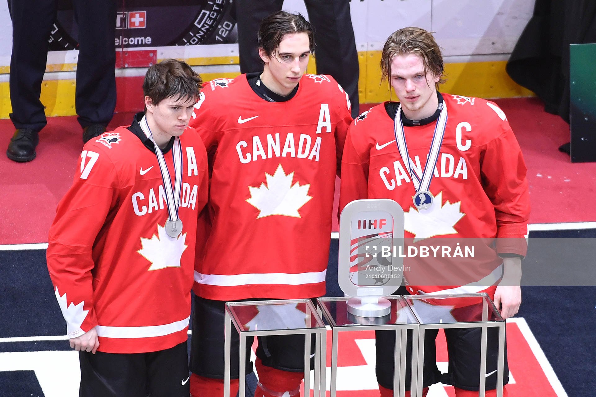 Connor McMichael, Dylan Cozens and Bowen Byram of Canada