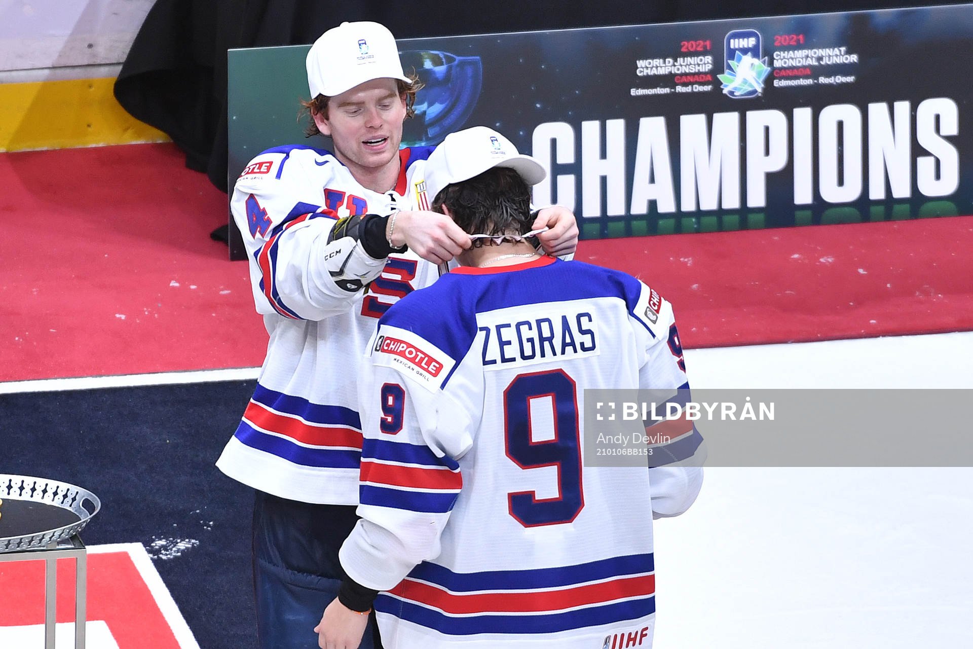 Cam York of USA presents his teammate Trevor Zegras with